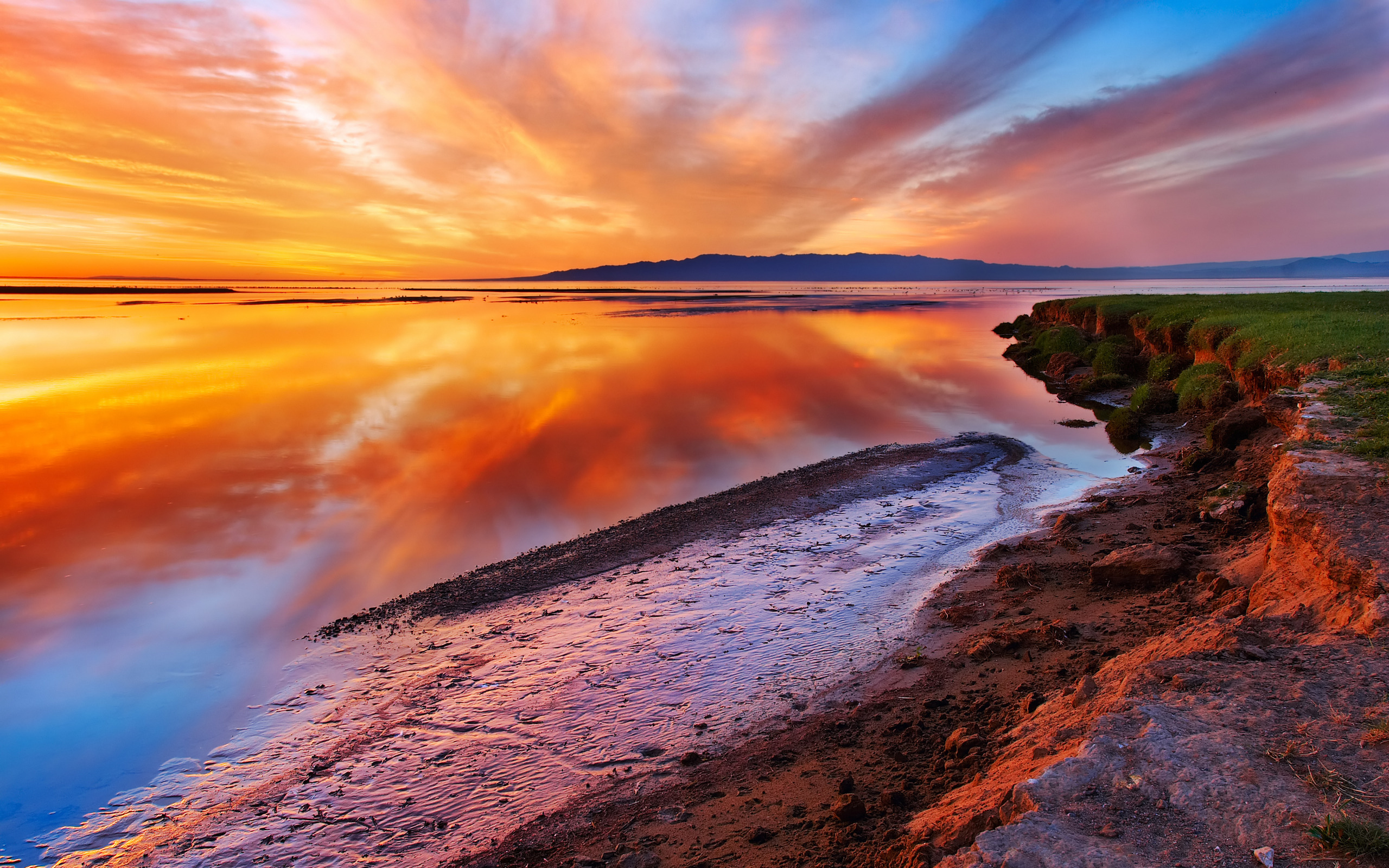 Free photo Orange sunset by the seashore