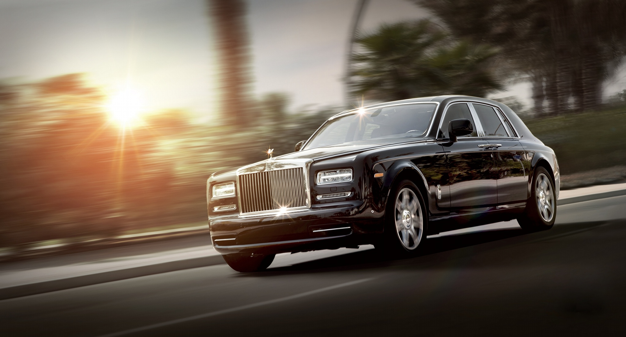 Black Rolls Royce rides into the sunset