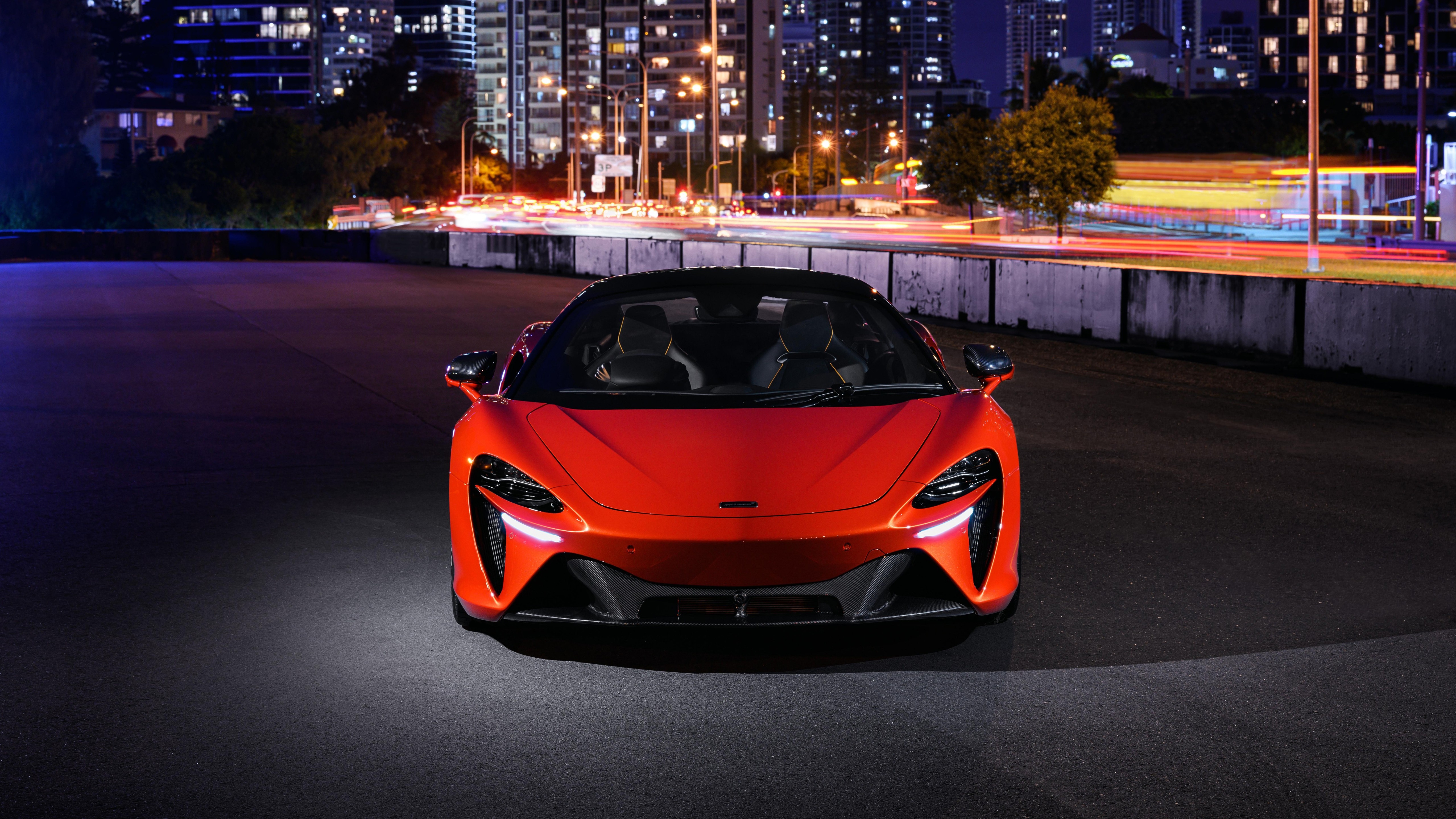 Free photo McLaren Artura red at night