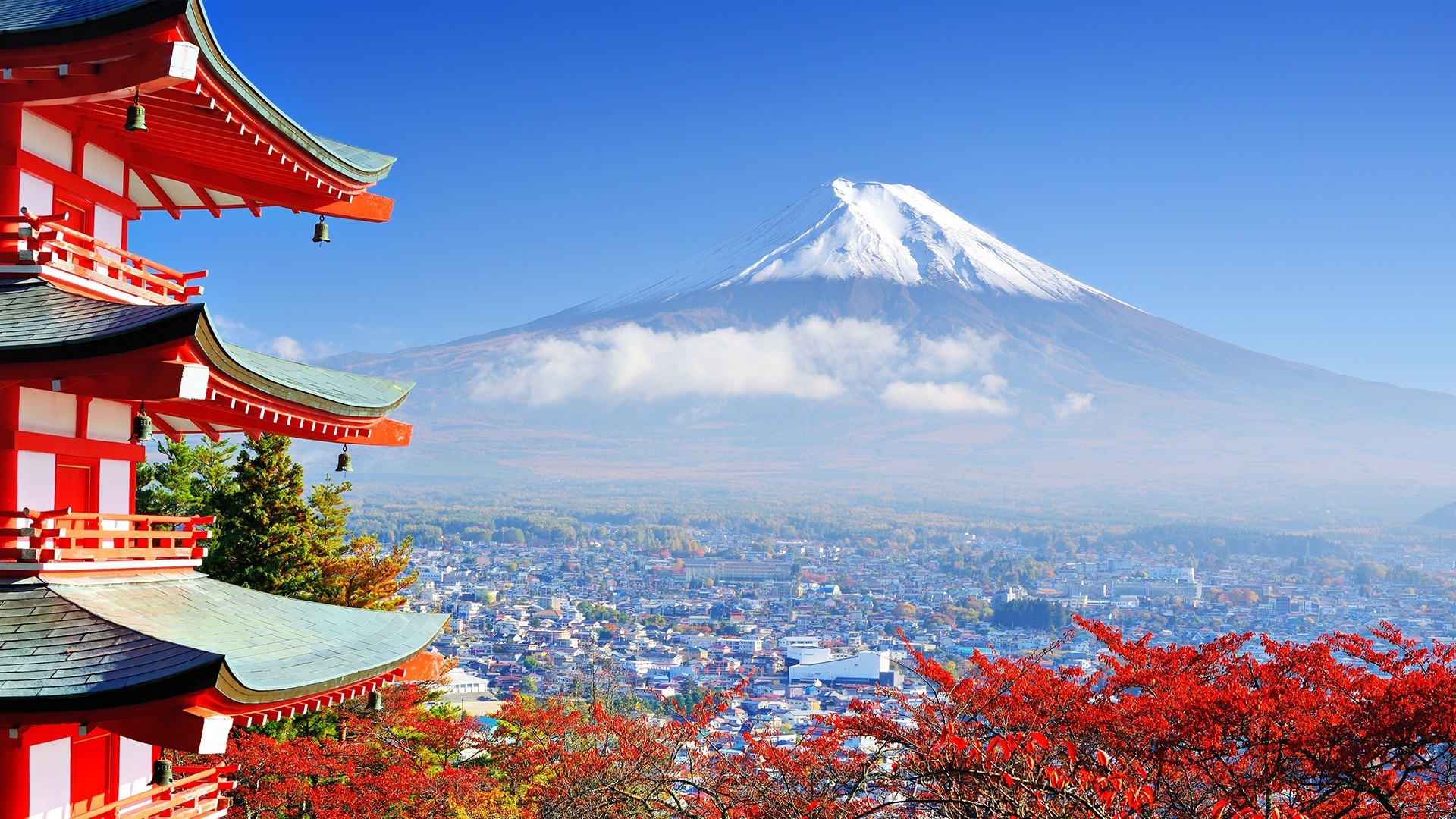 Asian architecture against the backdrop of a volcano