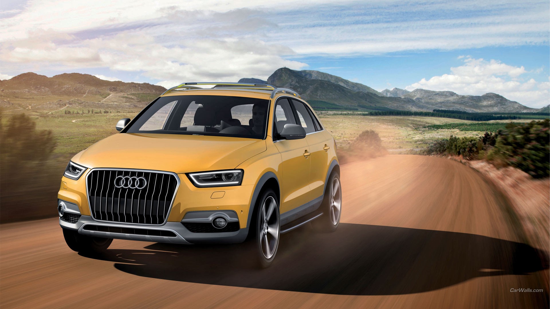 Бесплатное фото Audi Q3 едет по пыльной дороге