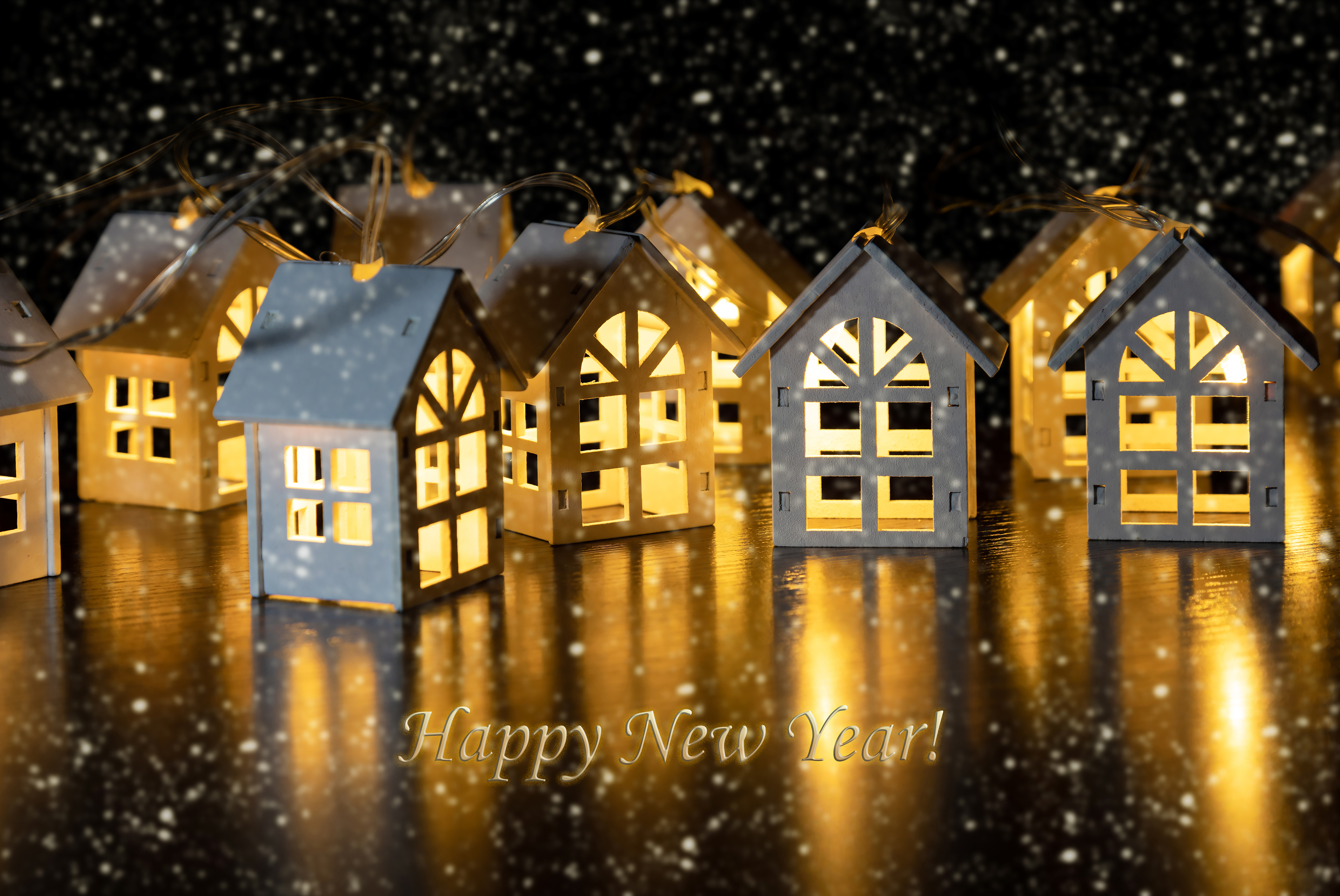 Бесплатное фото Новогодняя гирлянда в виде светящихся домиков