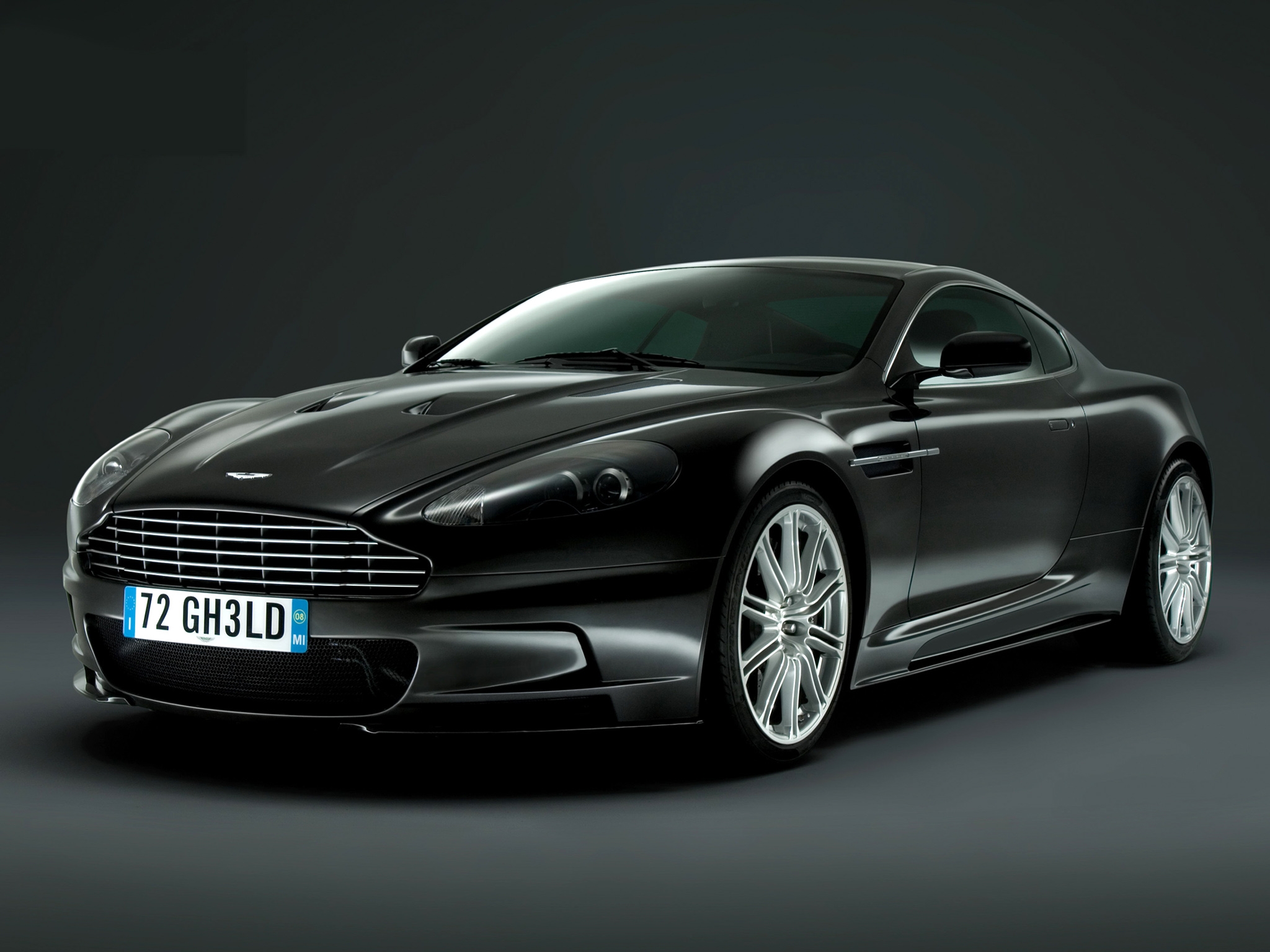 Free photo Black Aston Martin DB9 on a plain background