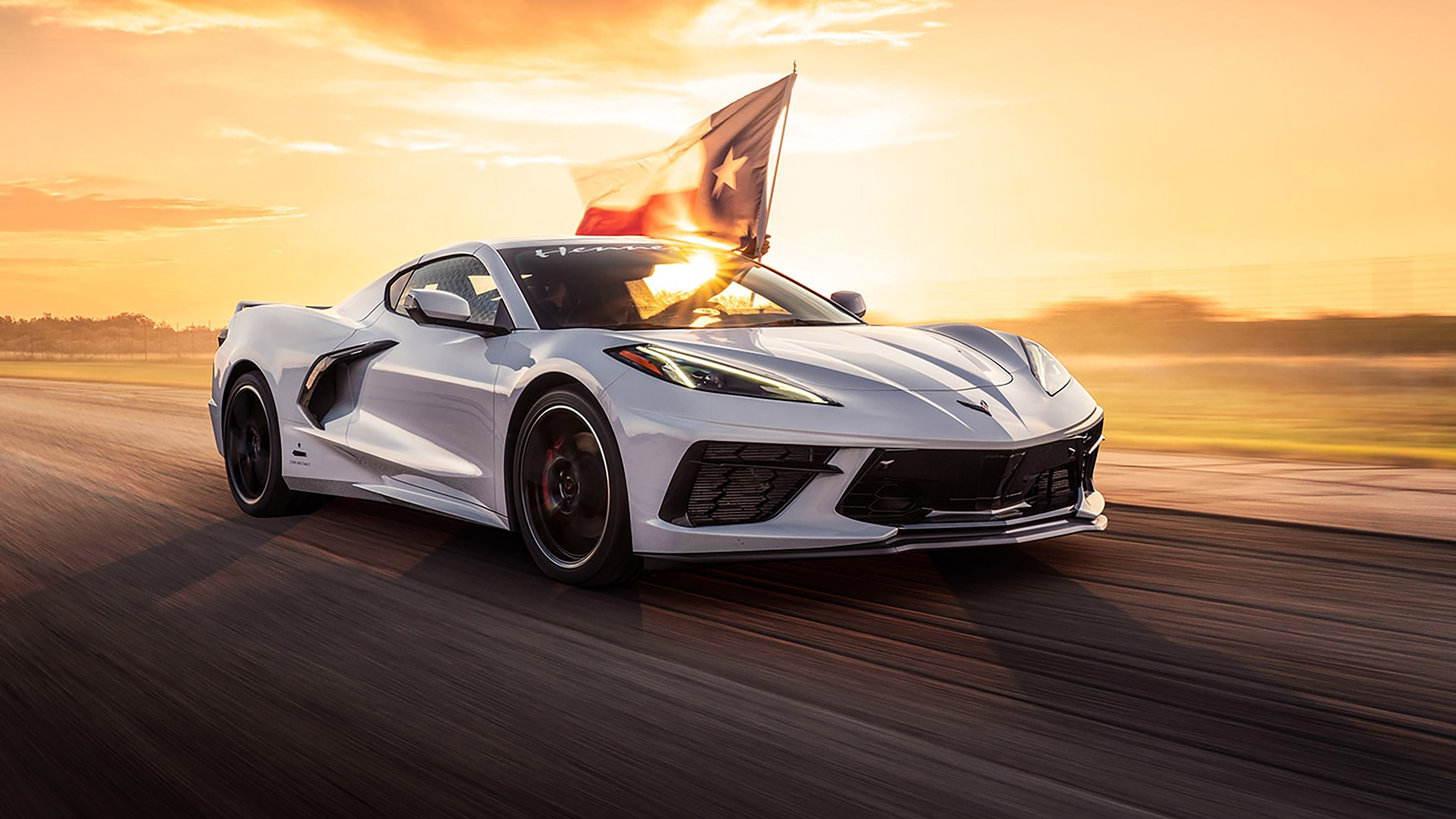 Free photo A white Chevrolet Corvette at sunset.