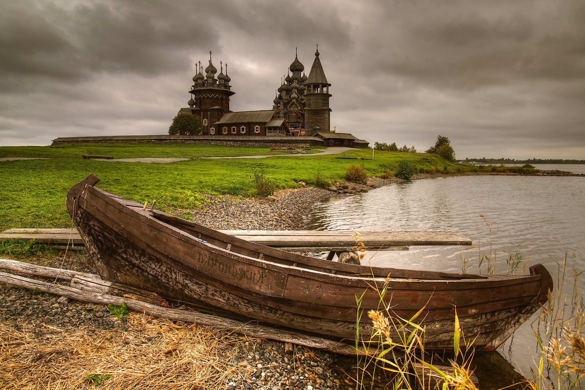 Free photo A wooden boat at a wooden church