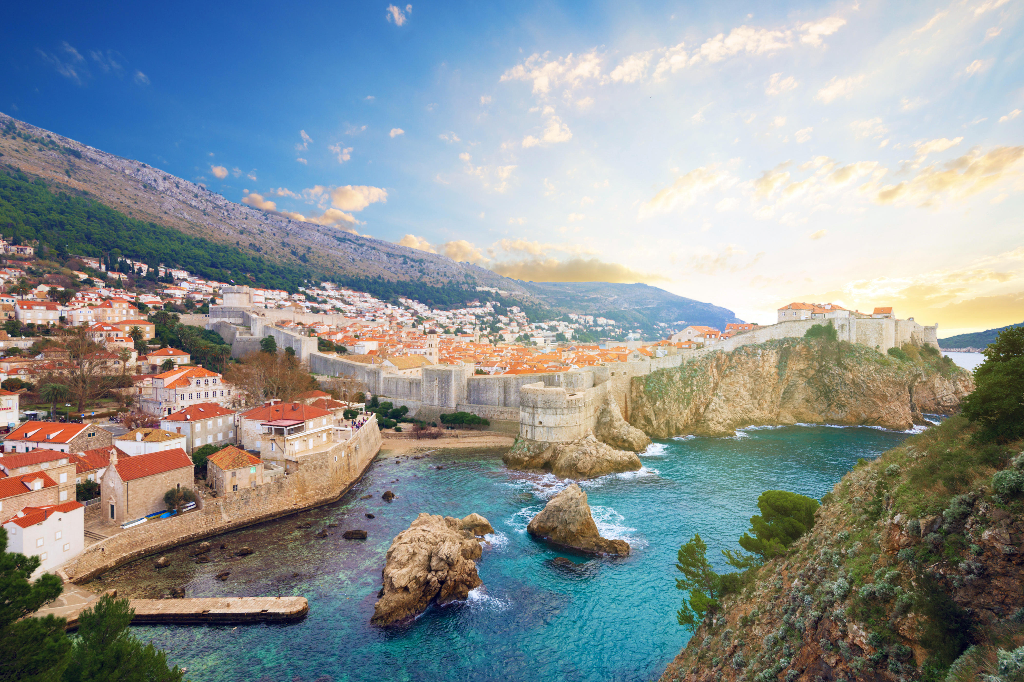 Free photo Large rocks in the water near the city of Dubrovnik