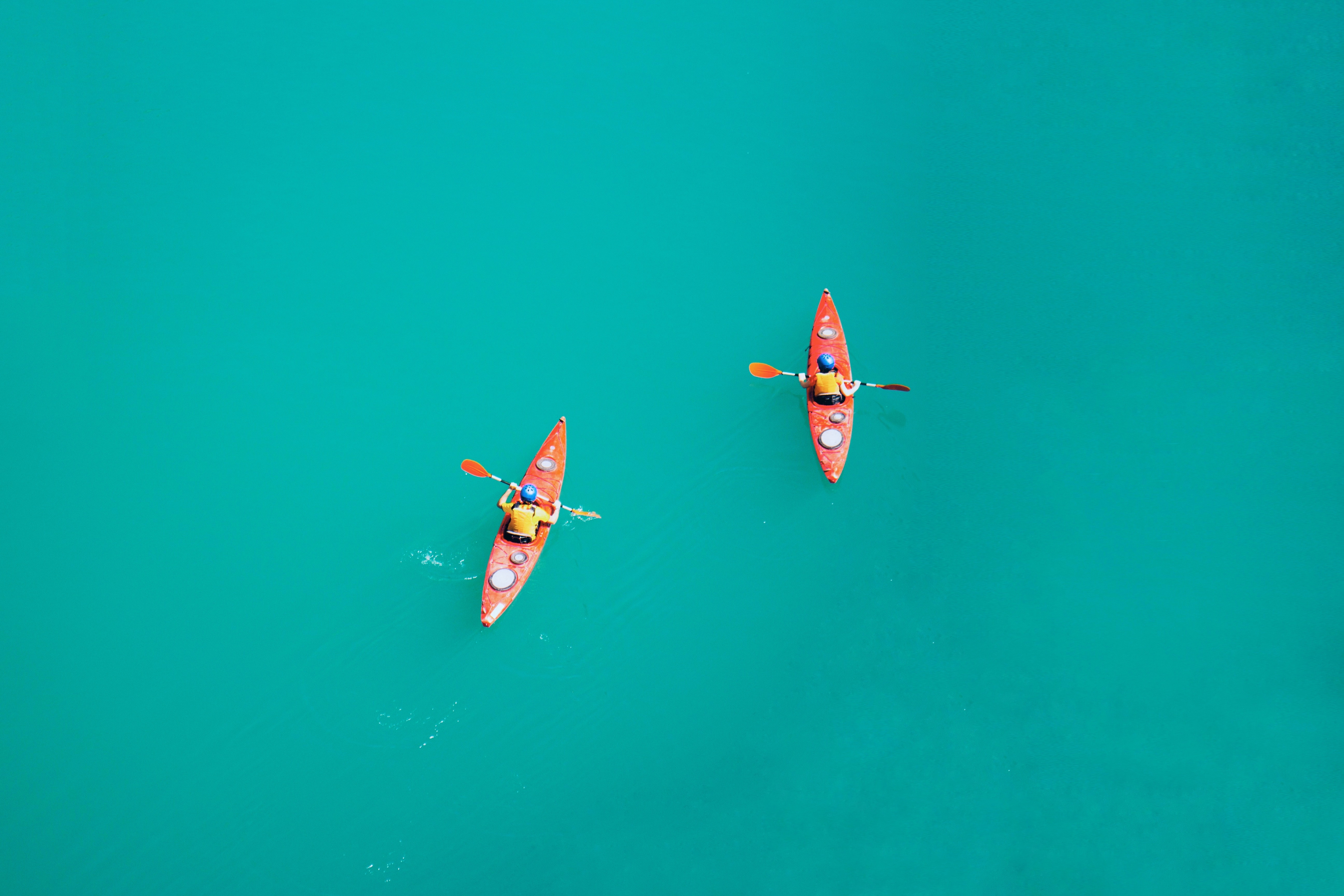 Two kayaks on a blue lake