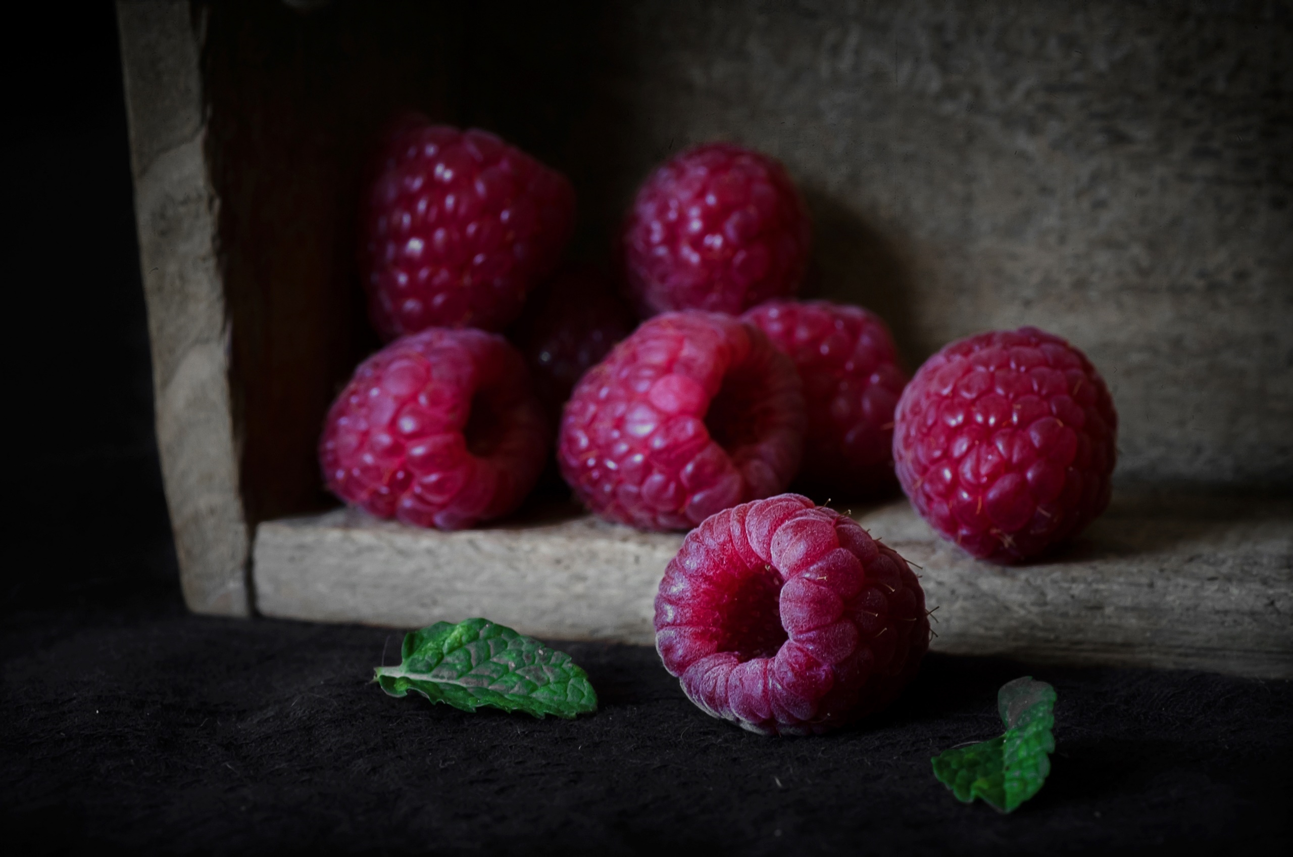 Fresh raspberries scattered on the table