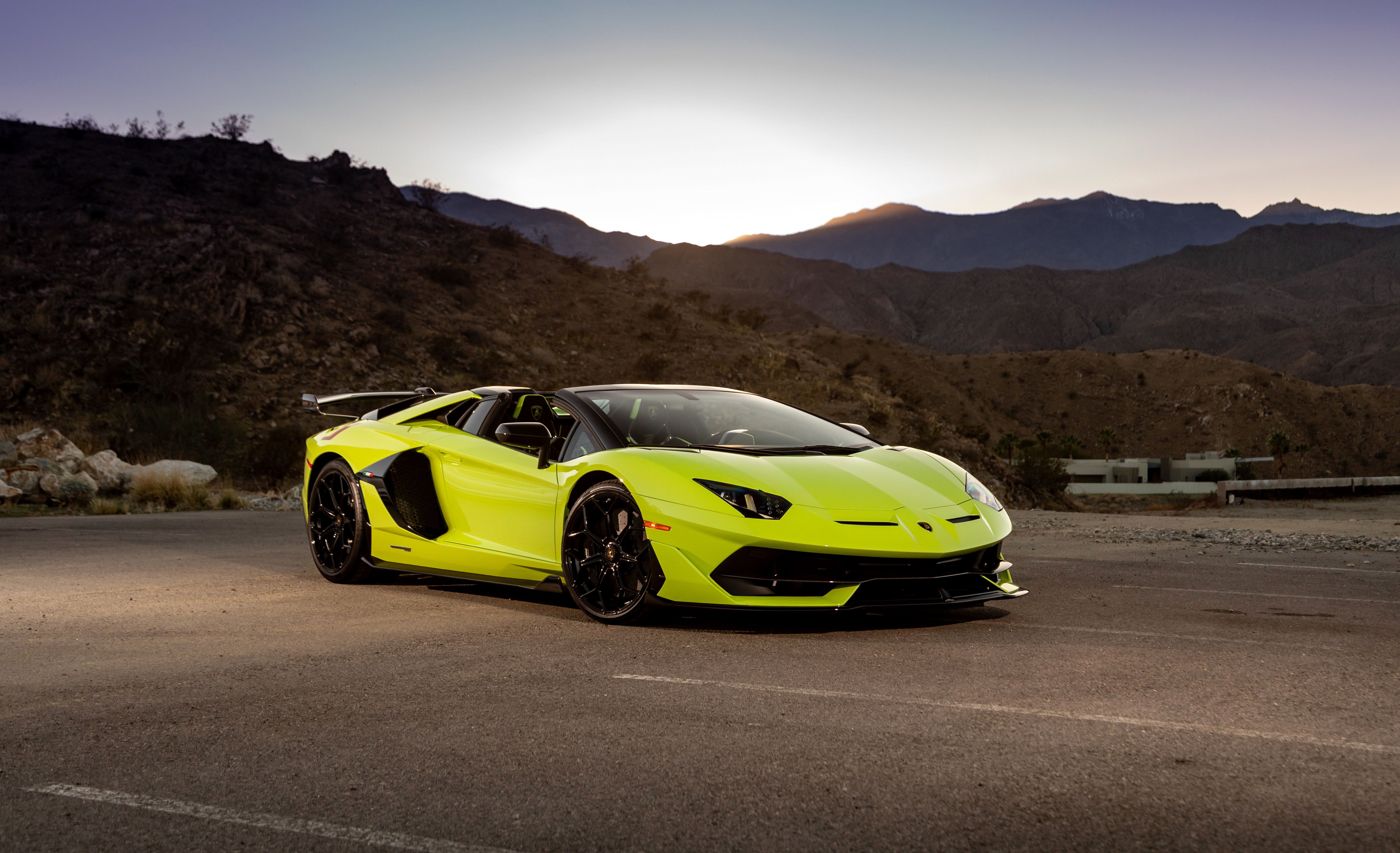 Free photo Bright green lamborghini aventador svj roadster with black inserts