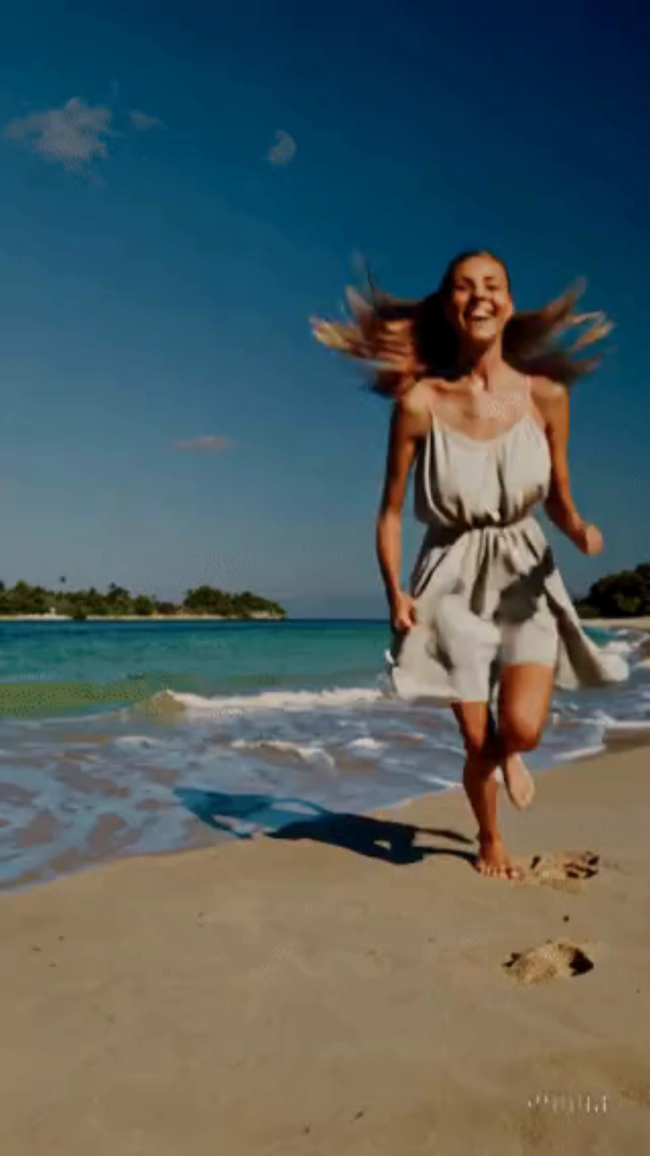 Free video A young girl runs barefoot on the sandy beach of a tropical resort