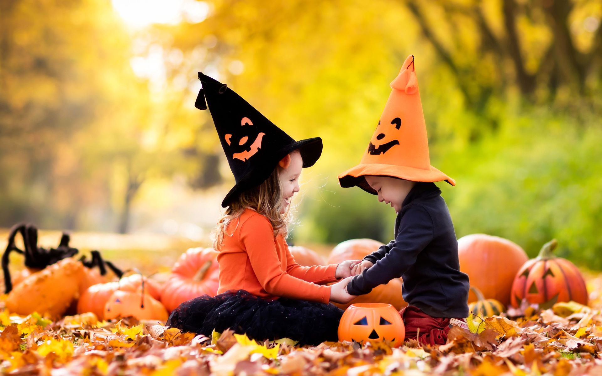 Two girls playing in Halloween hats