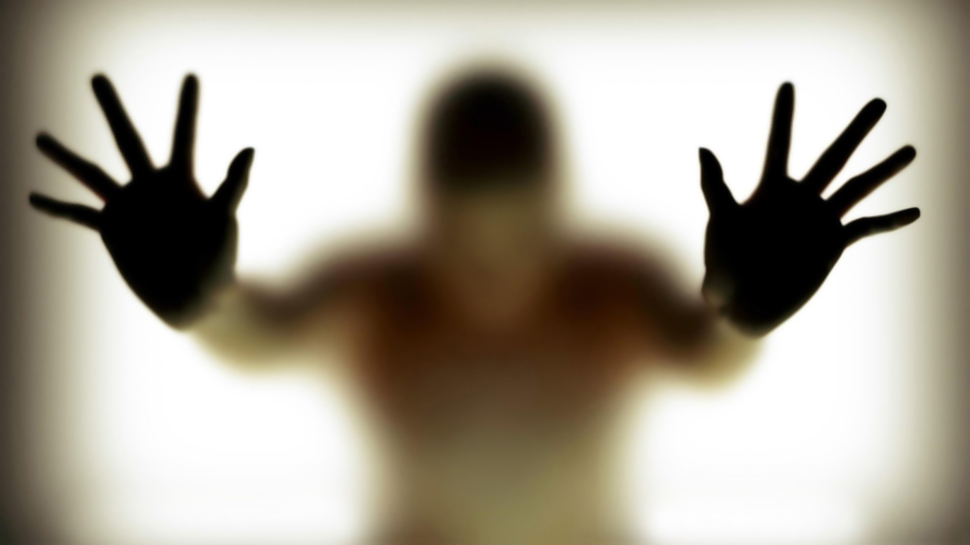 The figure behind the translucent barrier