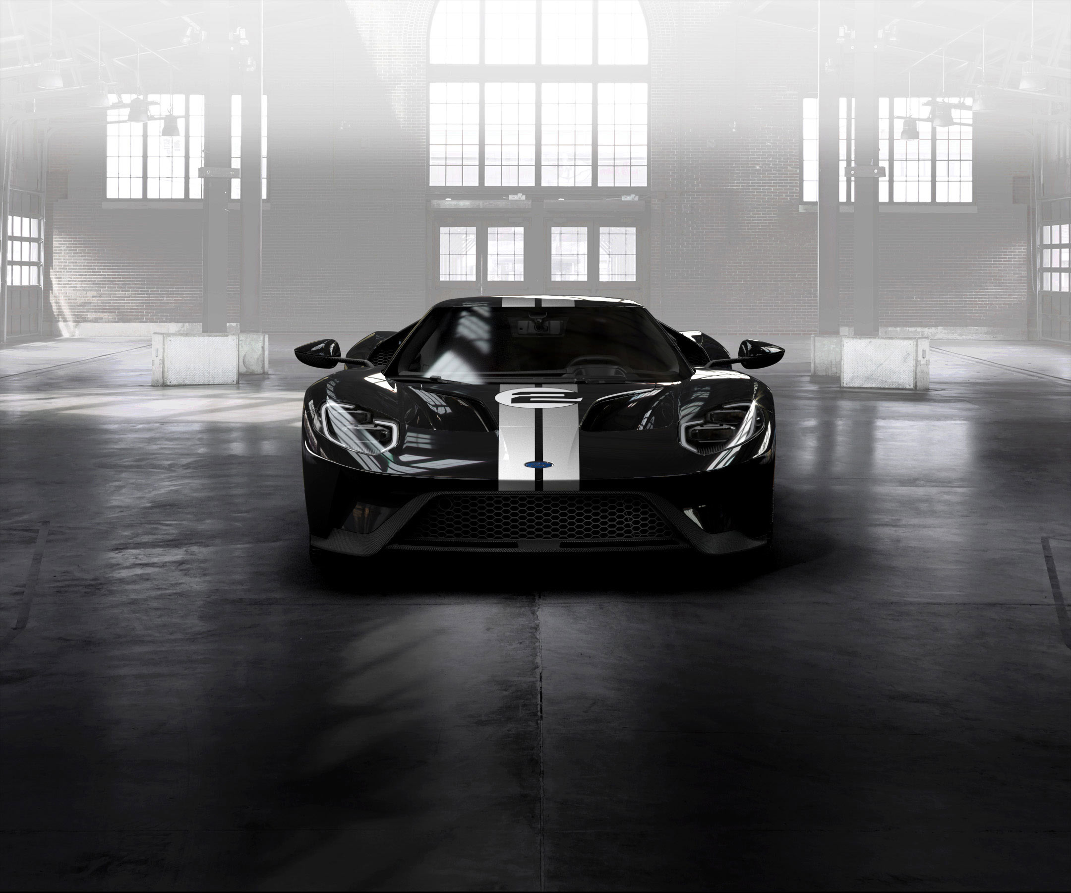 Бесплатное фото Черный ford gt в большом ангаре при солнечном свете