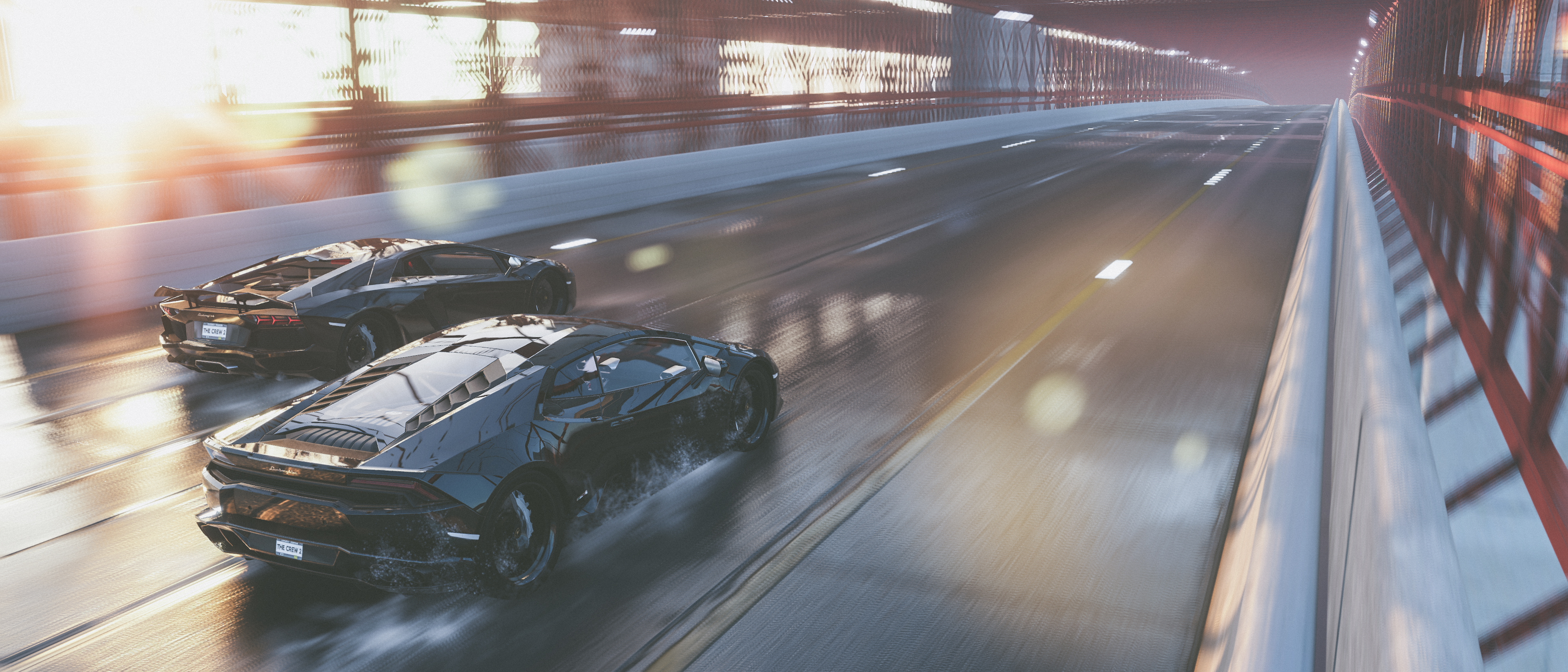 Free photo A wet tarmac race for two Lamborghinis.