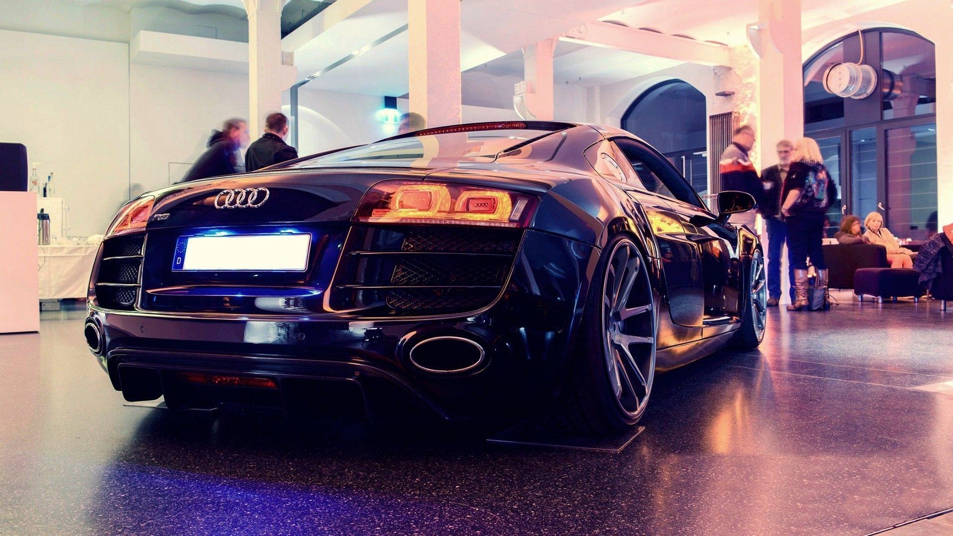 The Audi R8 is standing in a car dealership