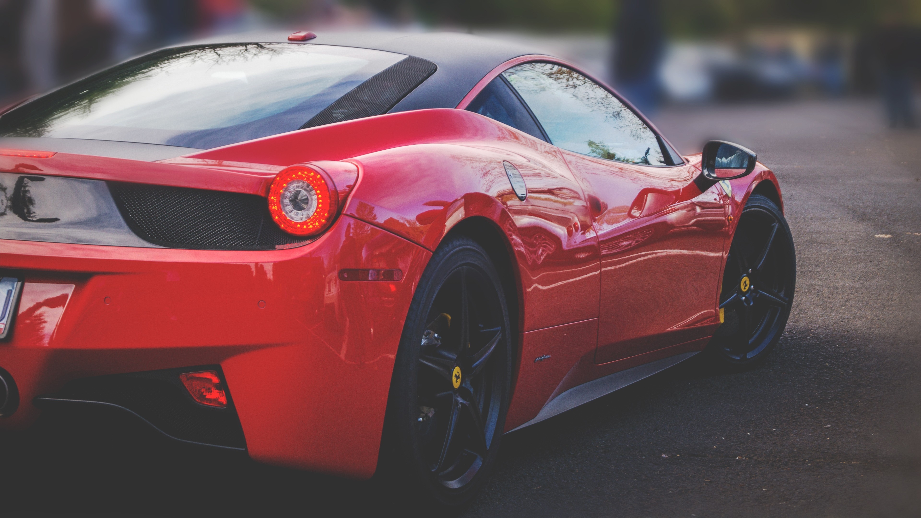 The rear end of a red ferrari