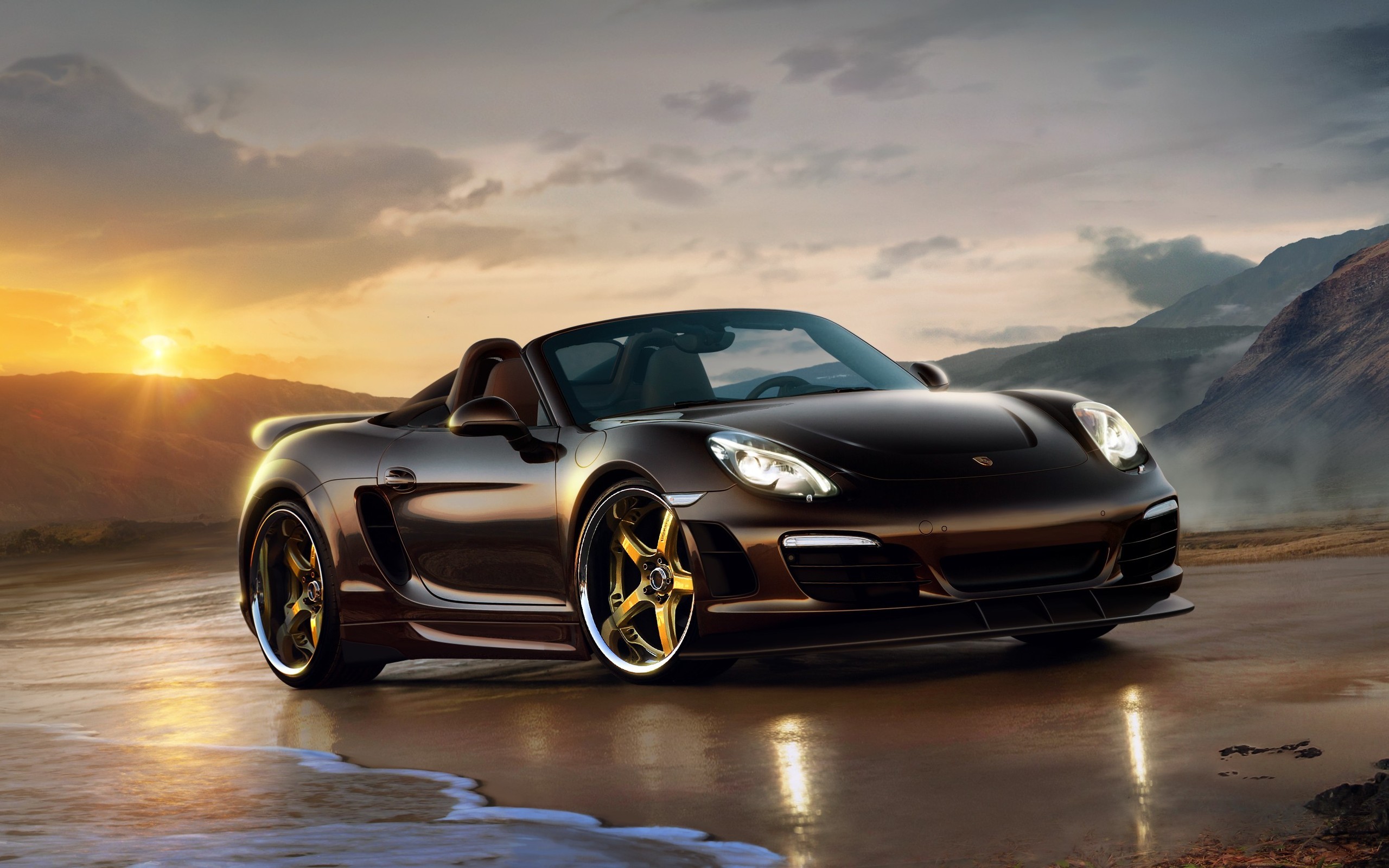 Free photo Porsche 911 convertible standing on a sandy beach by the sea