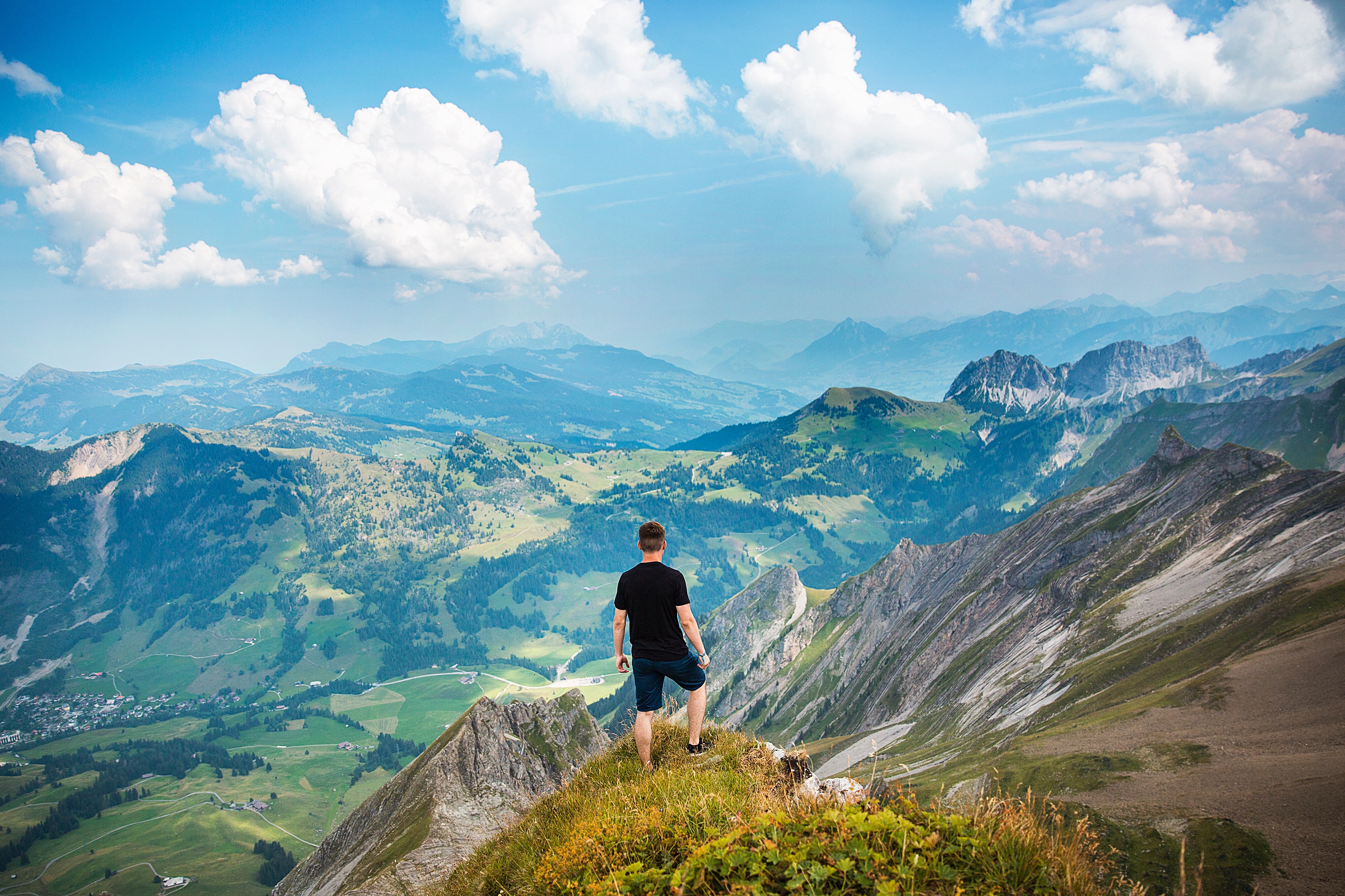 Free photo A young boy has conquered the highest peak