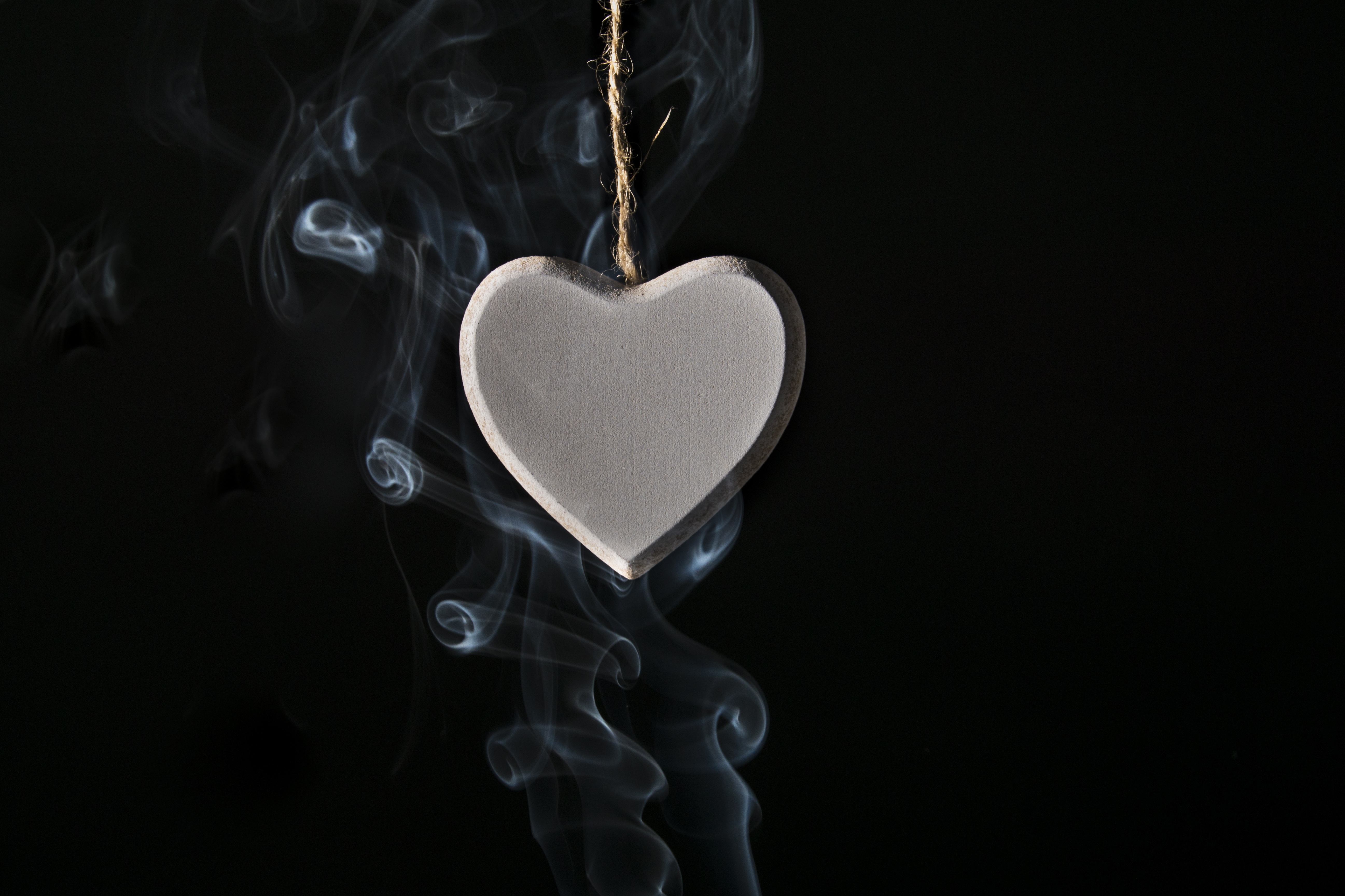 Free photo Locket heart in smoke