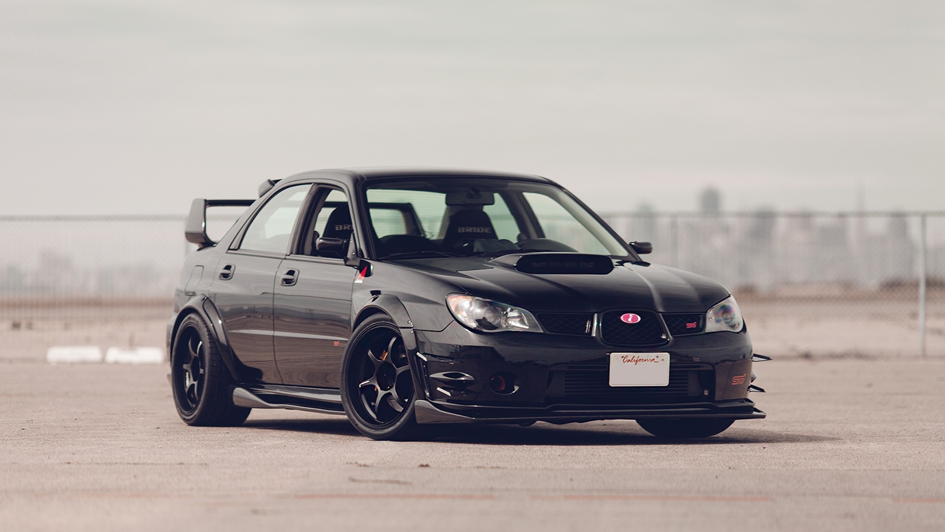 Free photo Black subaru impreza wrx sti on big black rims