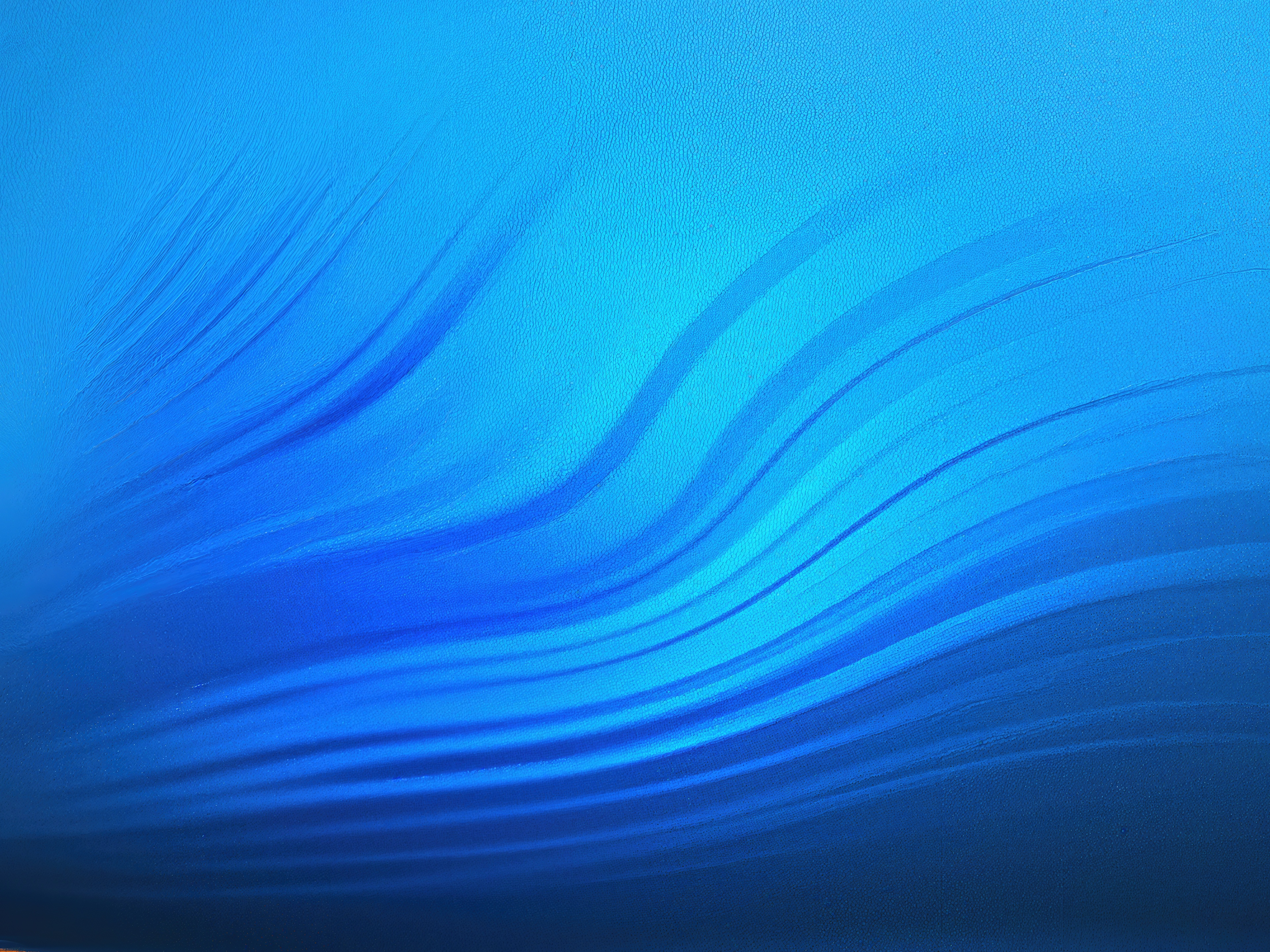 Free photo Abstract blue background with smooth undulating lines resembling the movement of water or silk fabric.