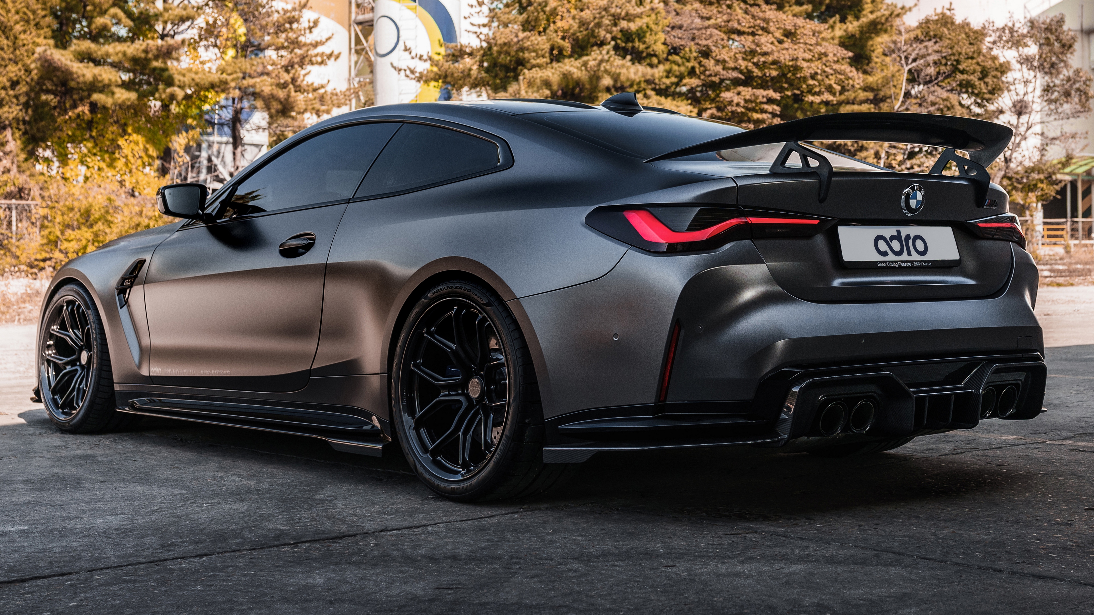 Free photo Black matte BMW M4 2022 rear view