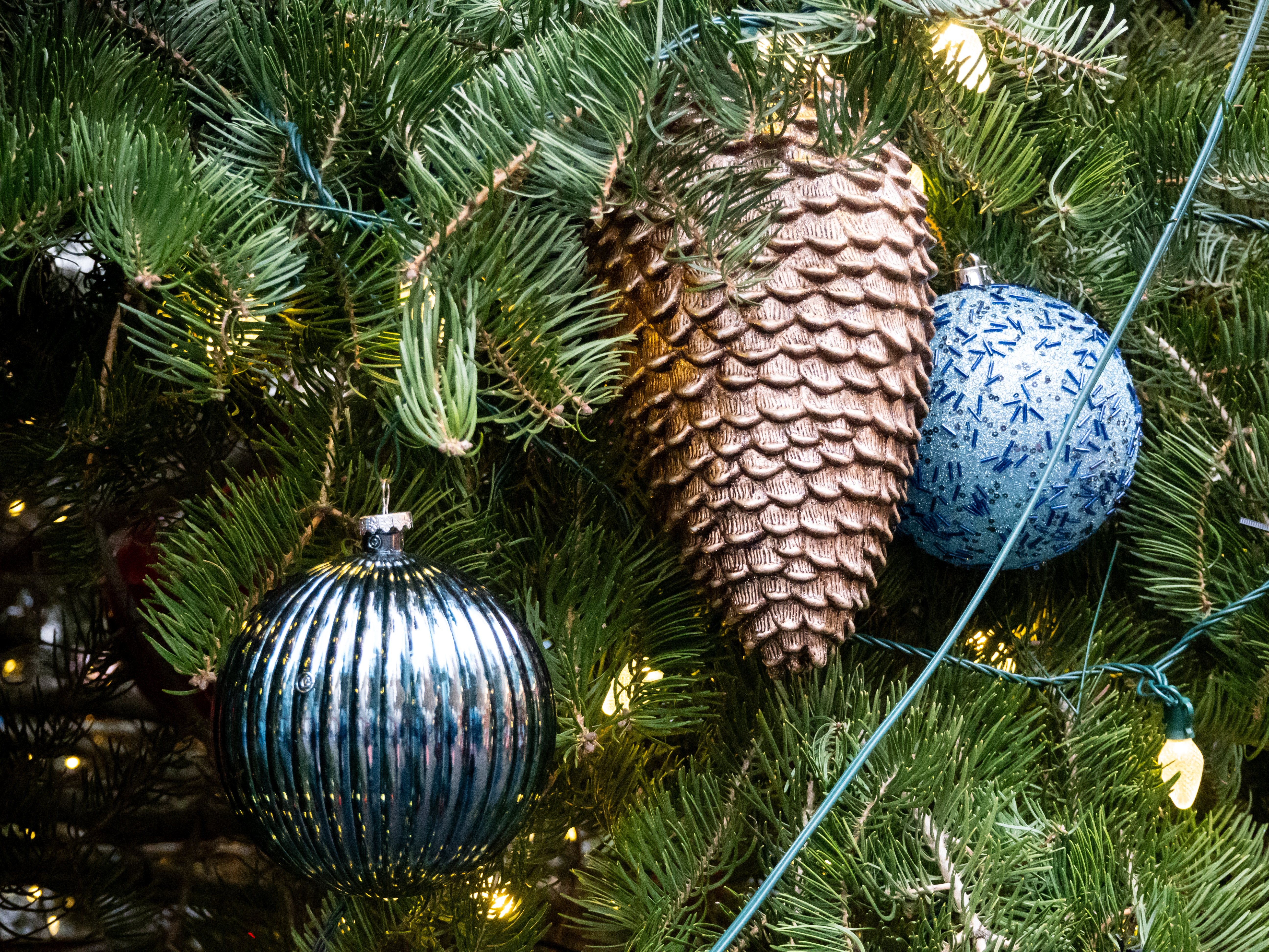 New Year`s toys with a checker on the branches of a fir tree