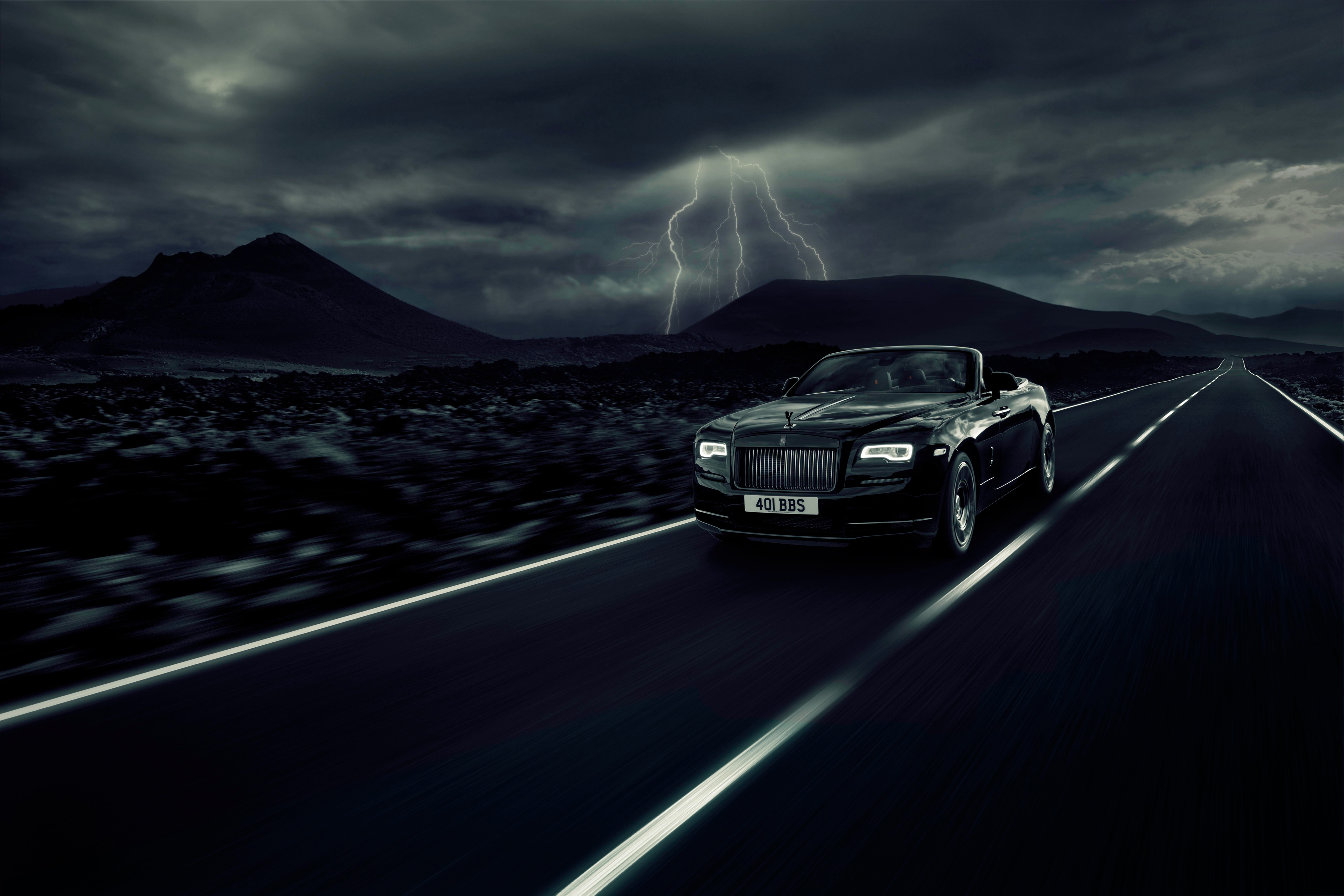 Free photo Rolls Royce Dawn Black Badge against a stormy sky