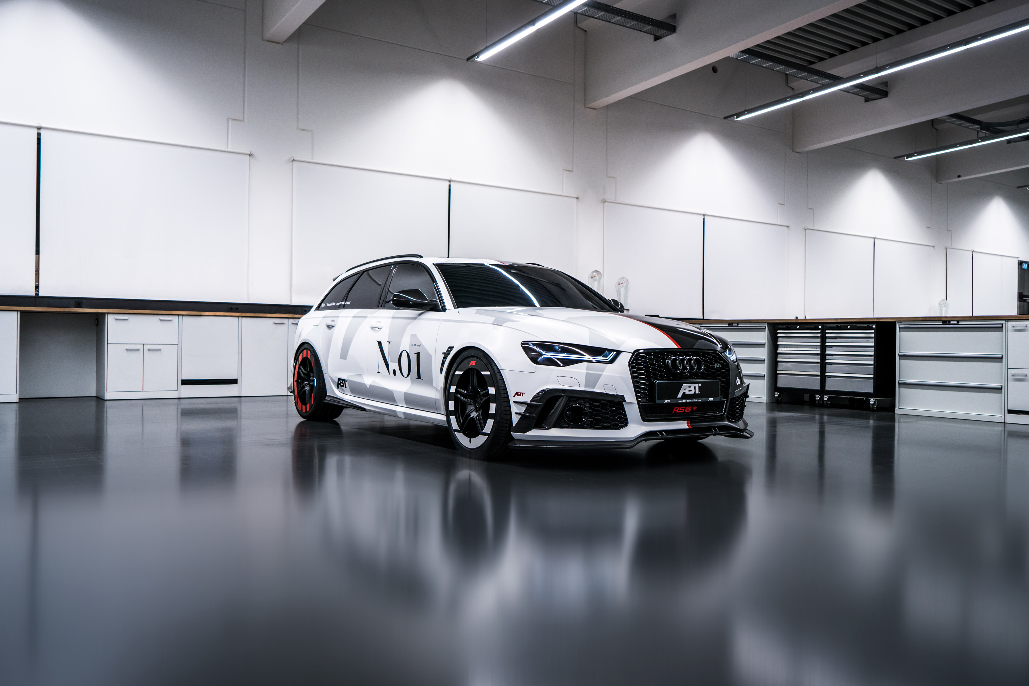 Free photo Audi in a big, bright hangar