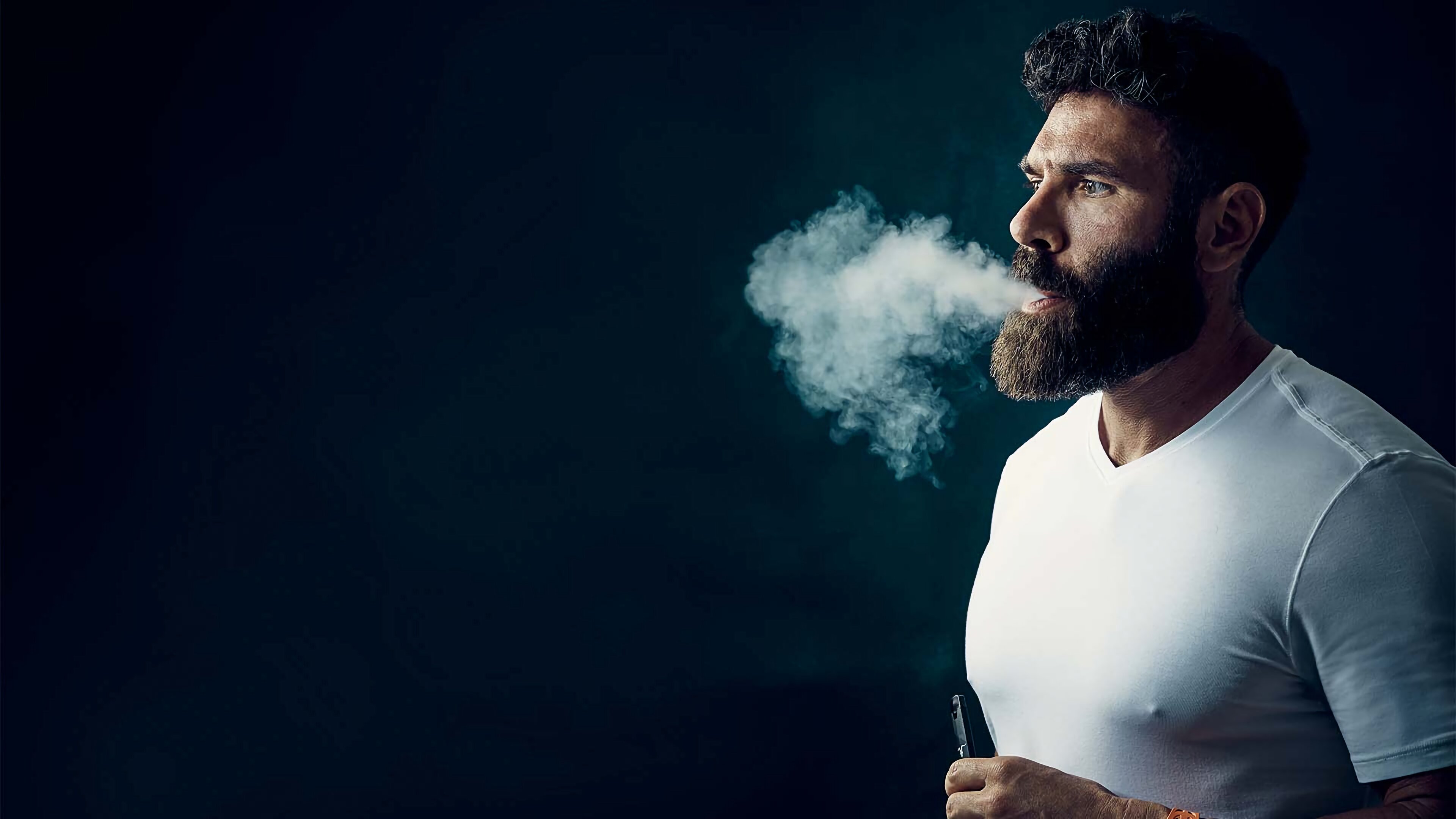 Free photo Dan Bilzerian exhales e-cigarette smoke