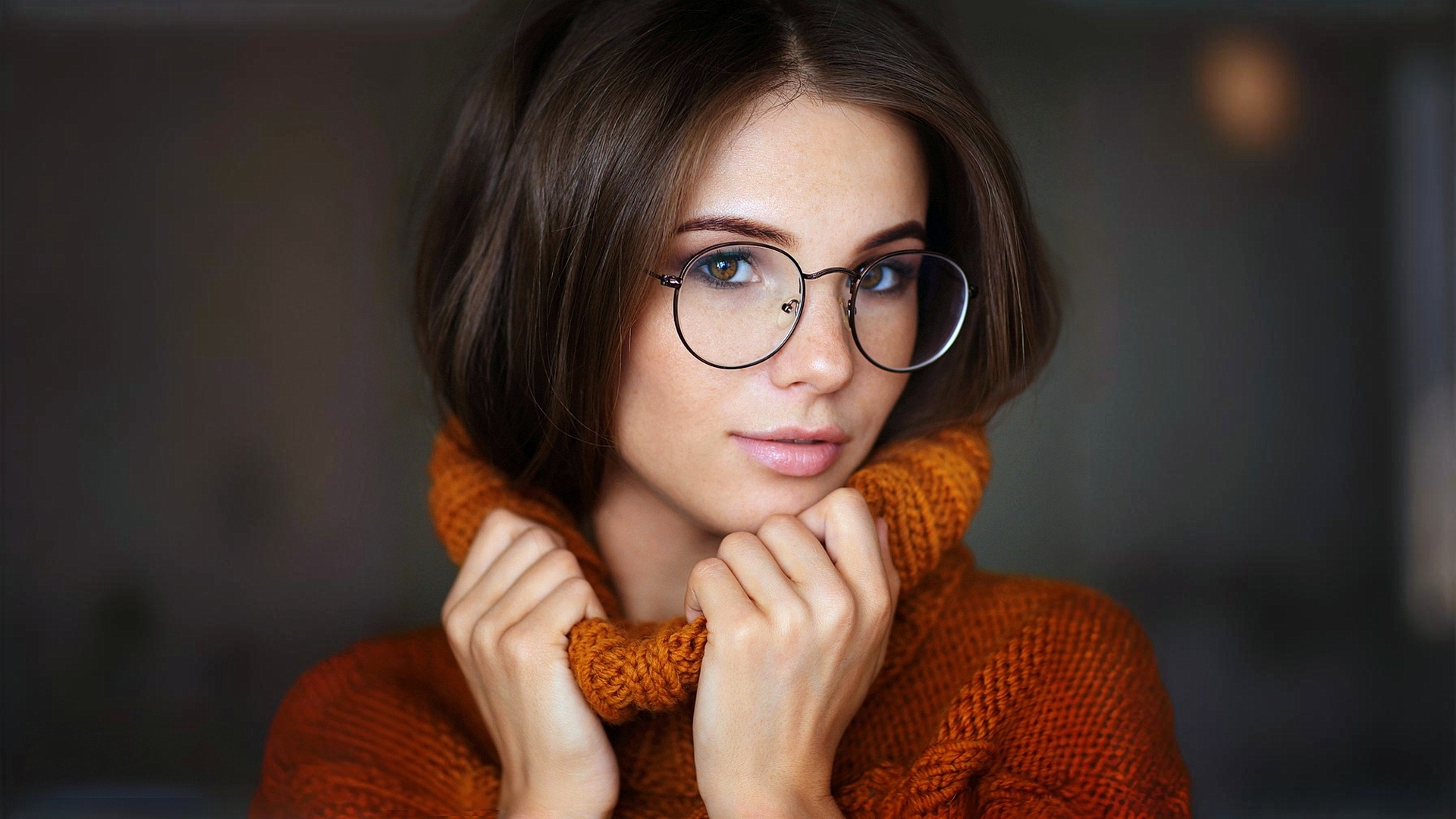 Model Anya Fedotova in glasses and yellow sweater