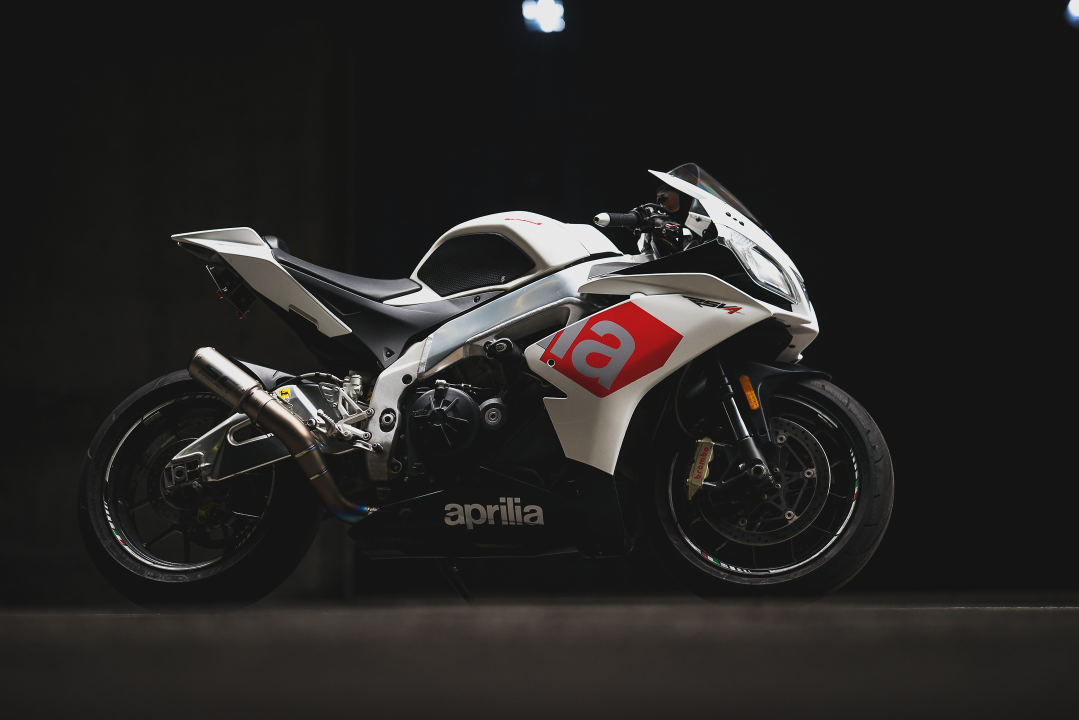 Free photo Sports motorcycle aprilia rsv4 on black background