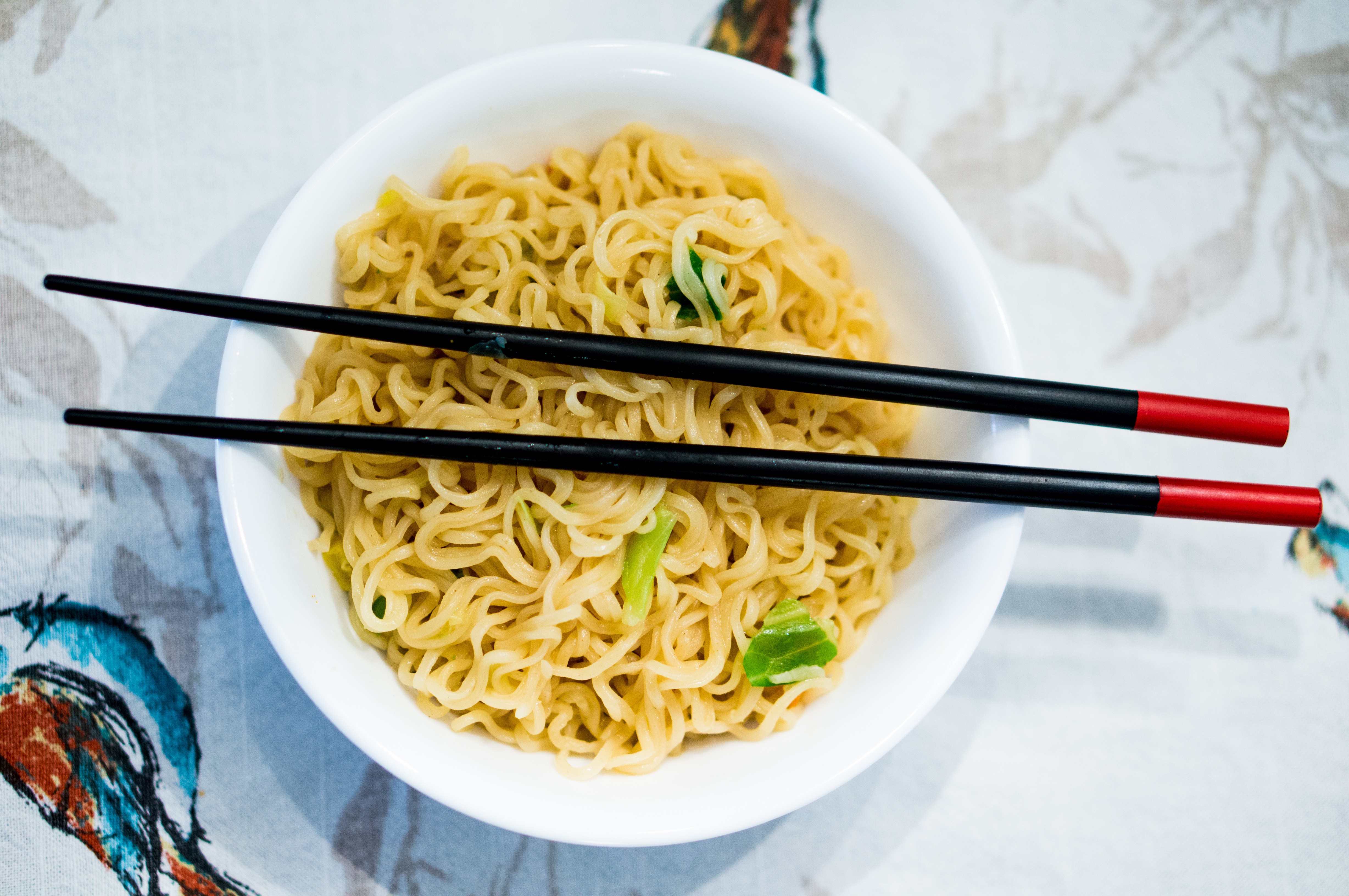 Free photo Chinese noodles with Chinese chopsticks.