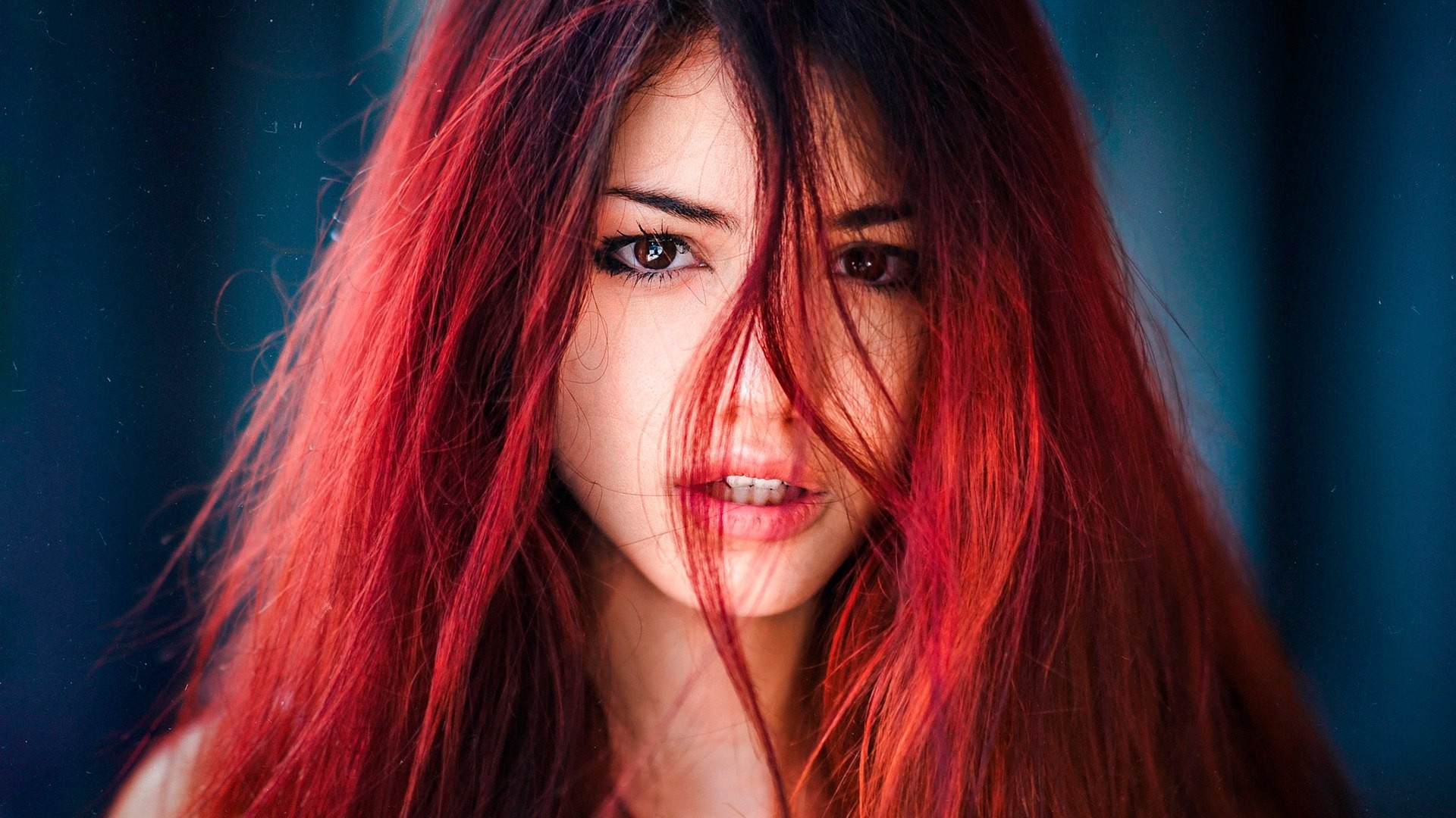Red-haired beautiful girl with long hair
