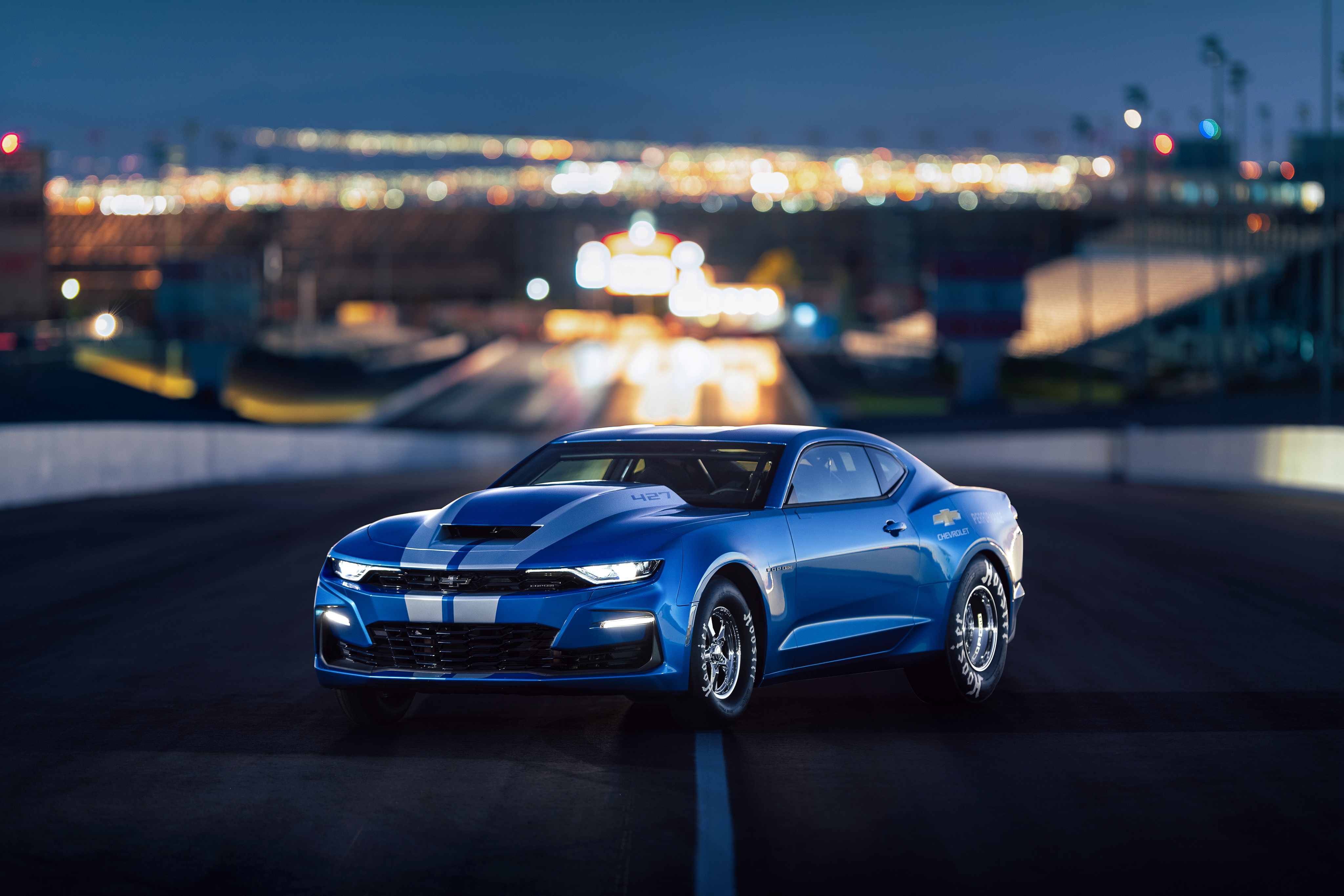 Free photo Blue Chevrolet Camaro with white stripes.