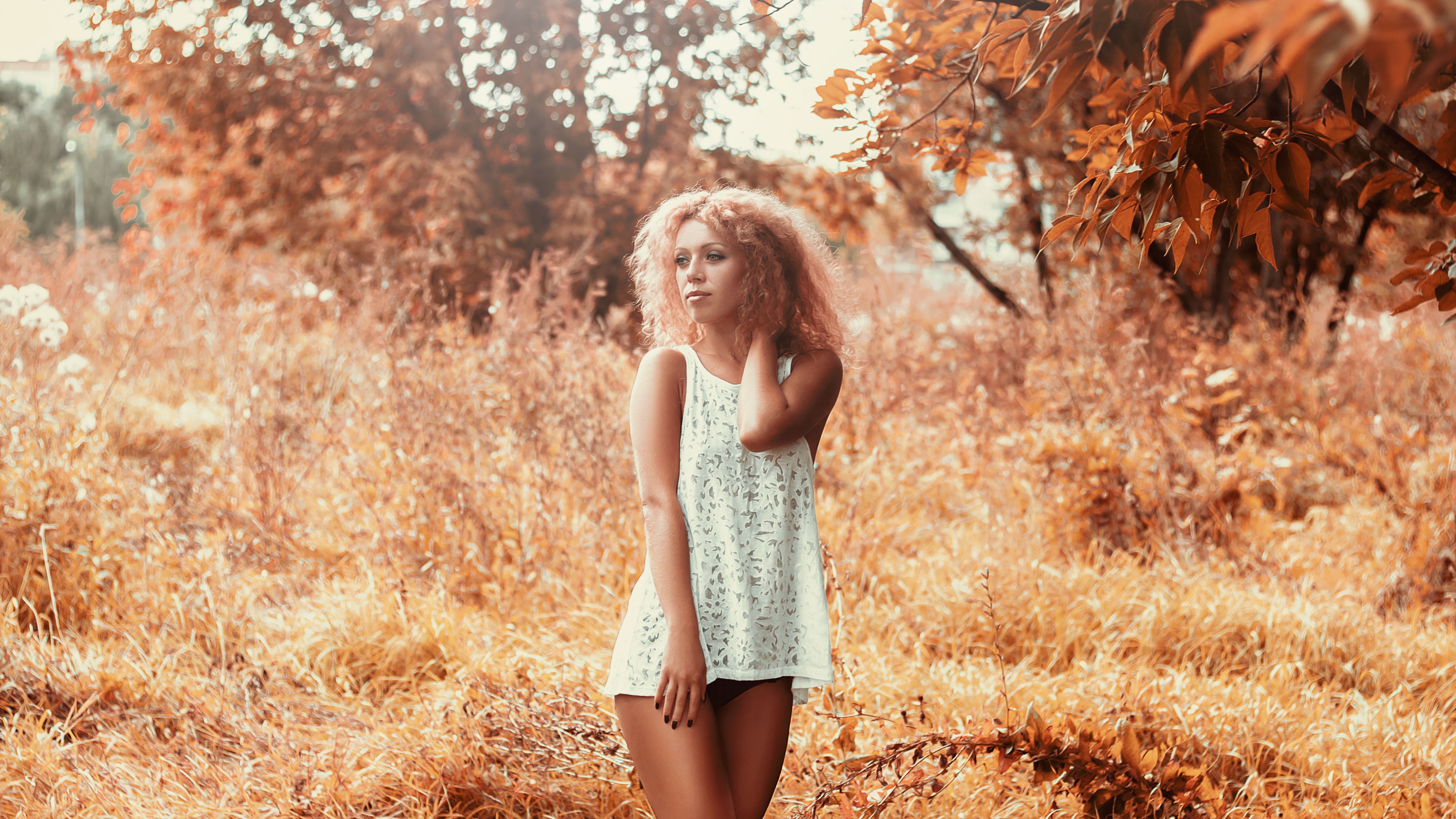 Free photo A girl in a light white dress in nature