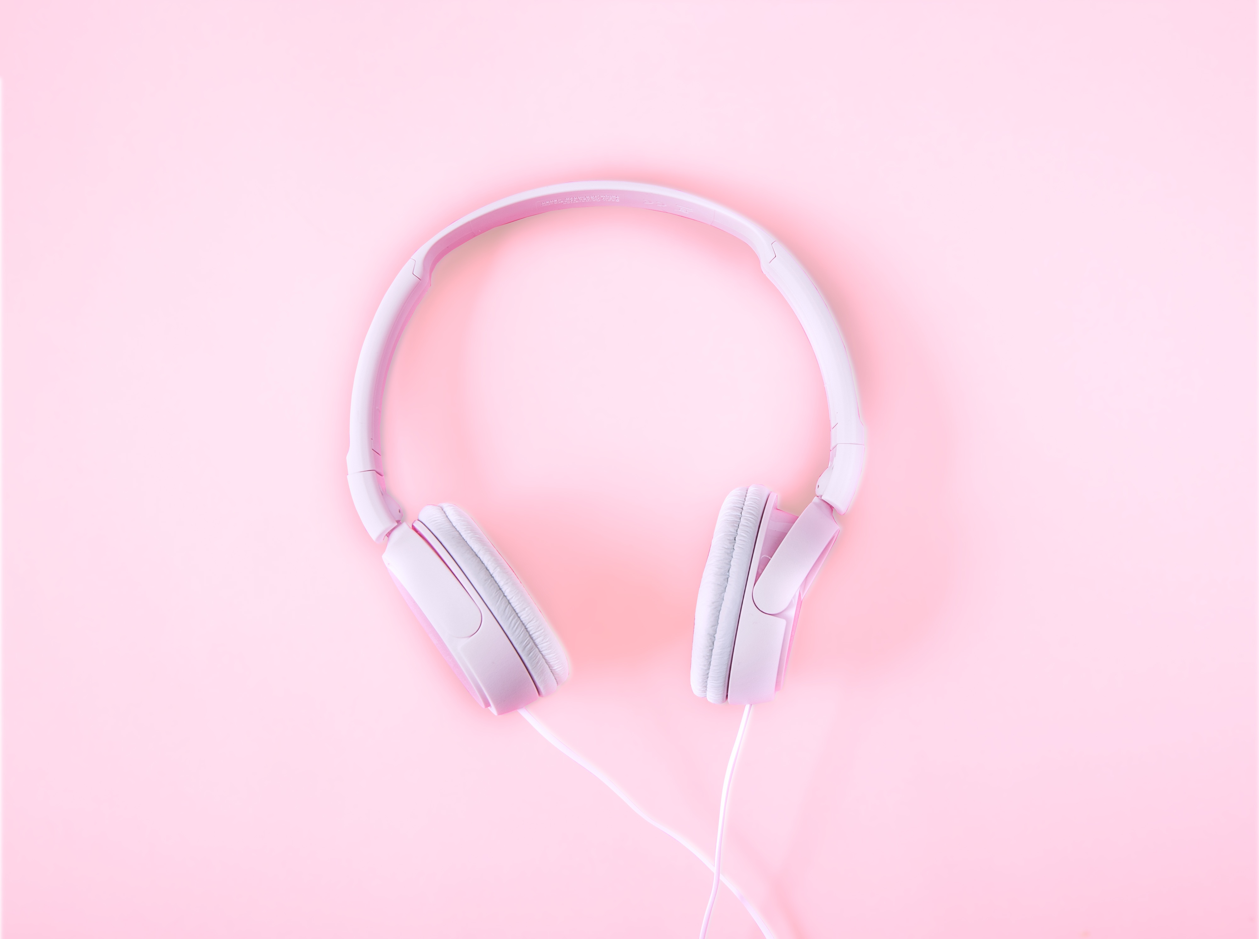 Headphones on a pink background