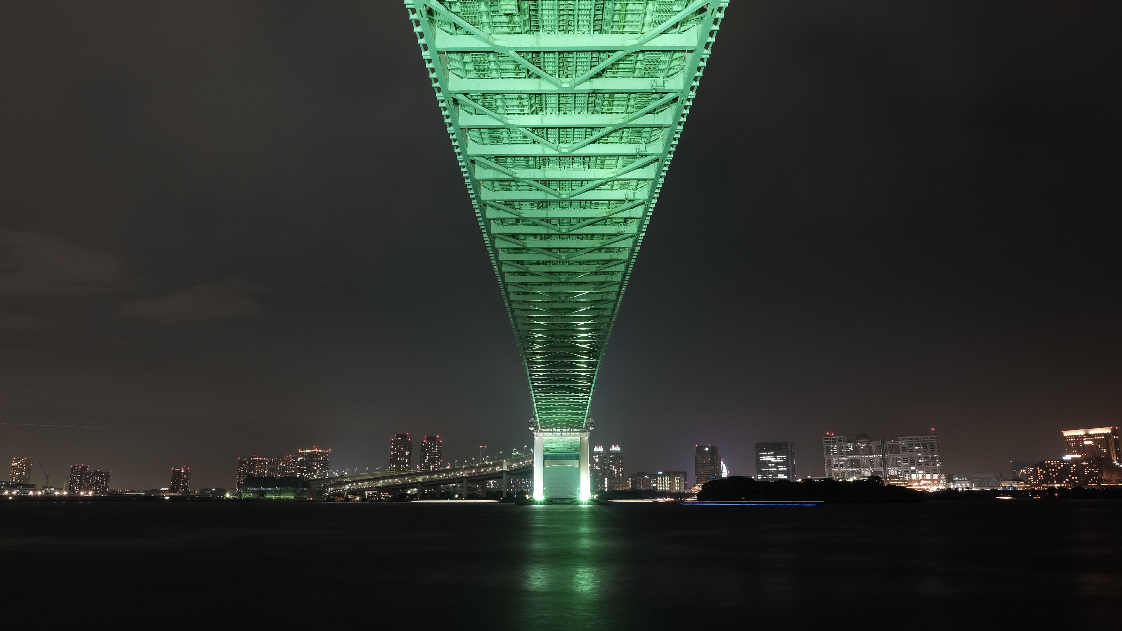 A night bridge over a river in Japan