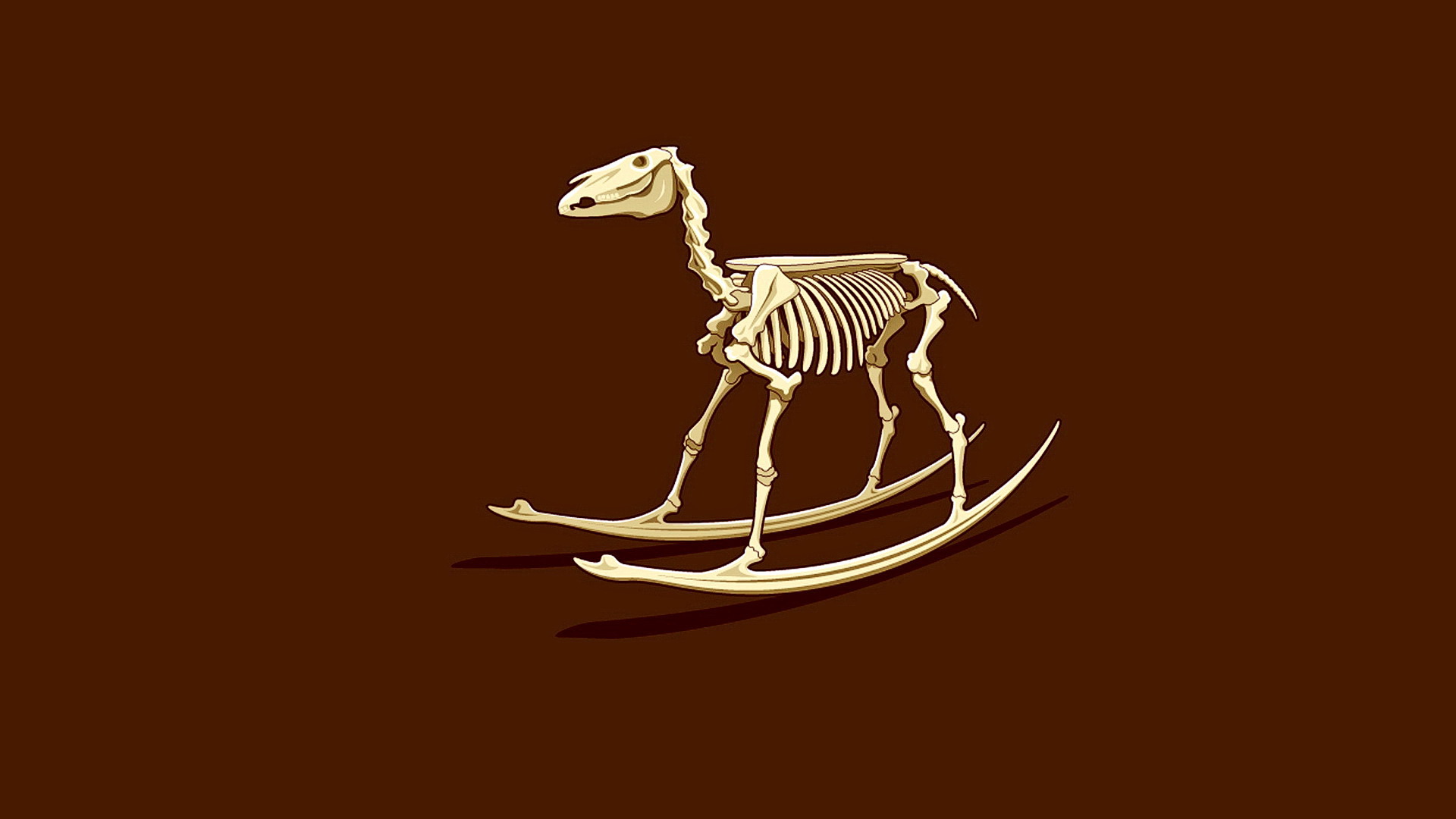 Children`s rocking horse skeleton on brown background