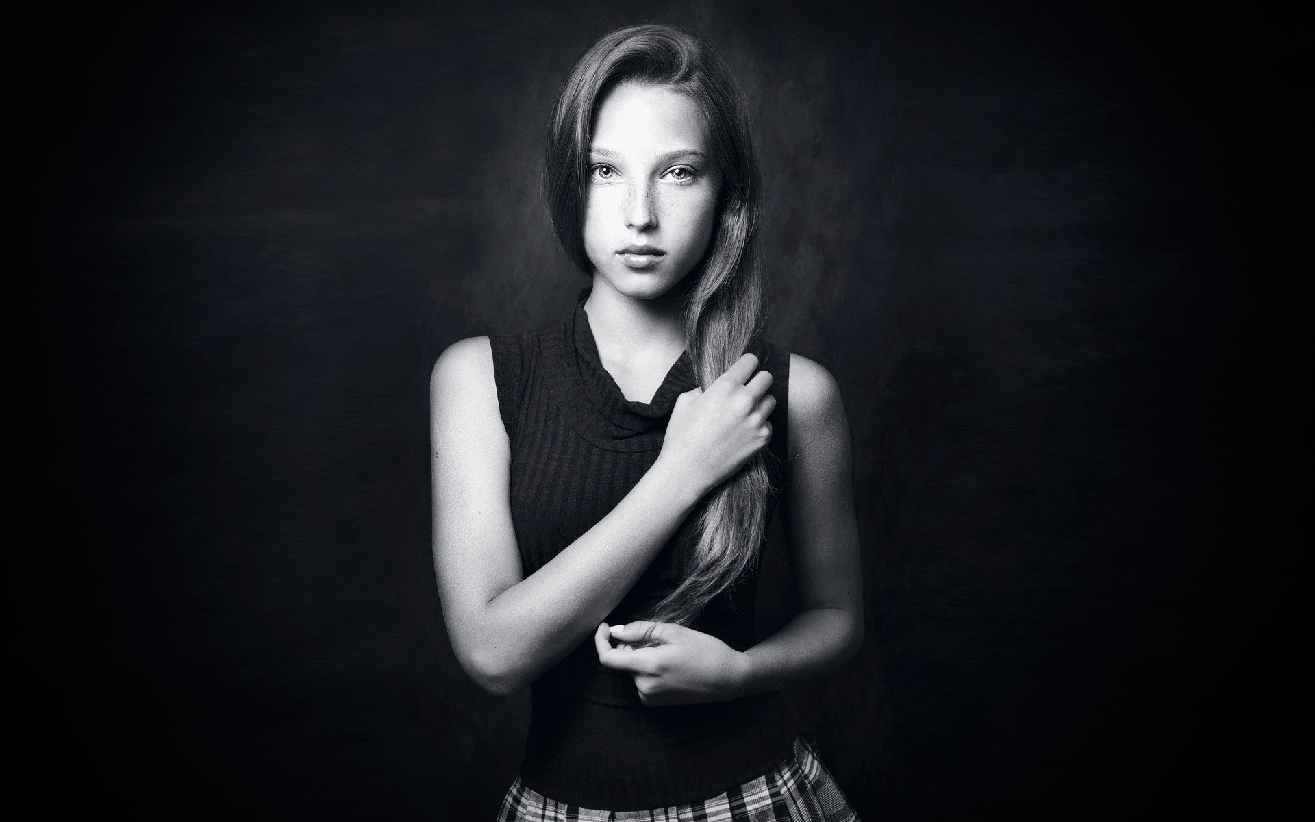 Free photo Girl with long hair on black background