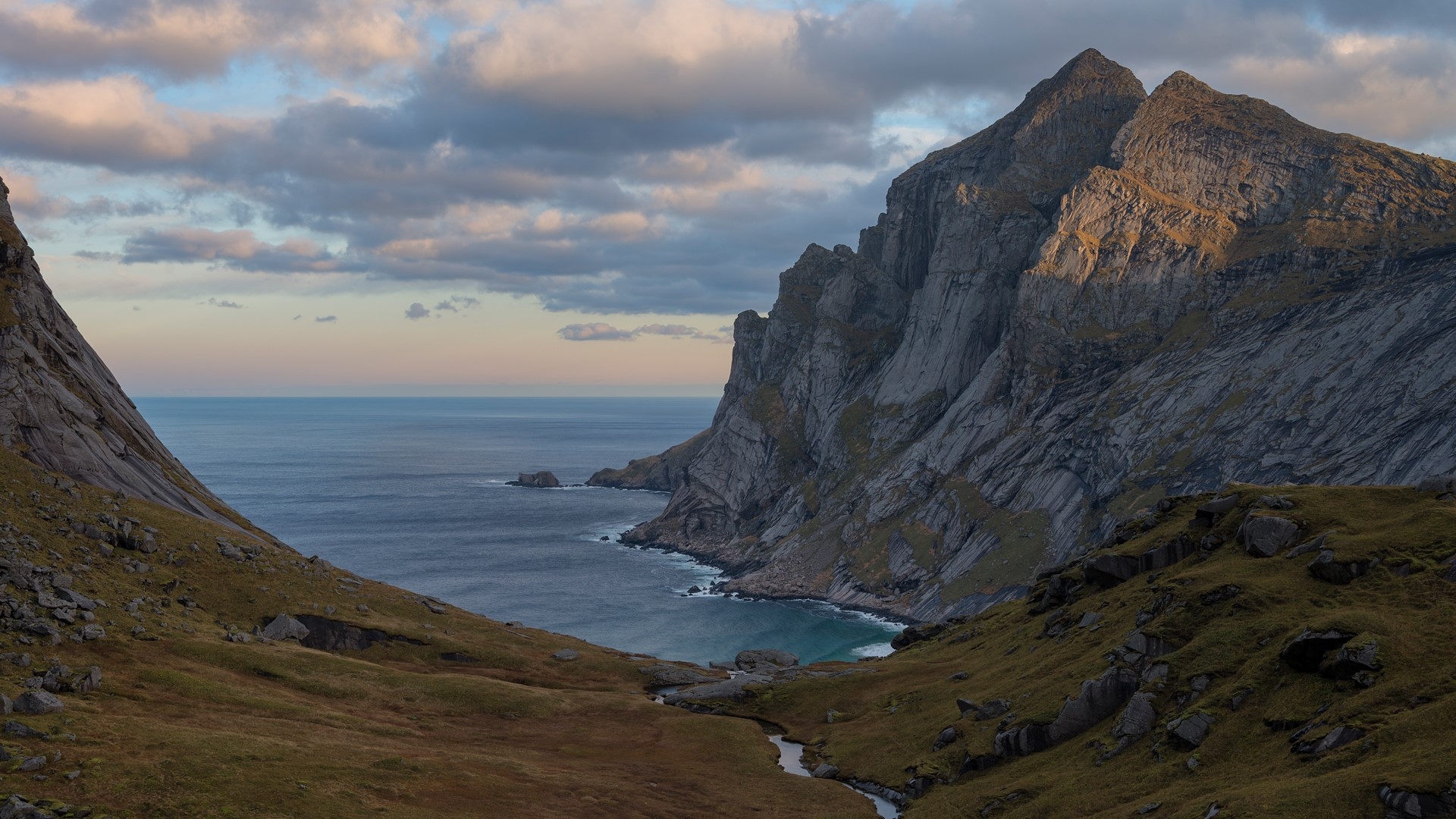 A mountain river falls into the sea