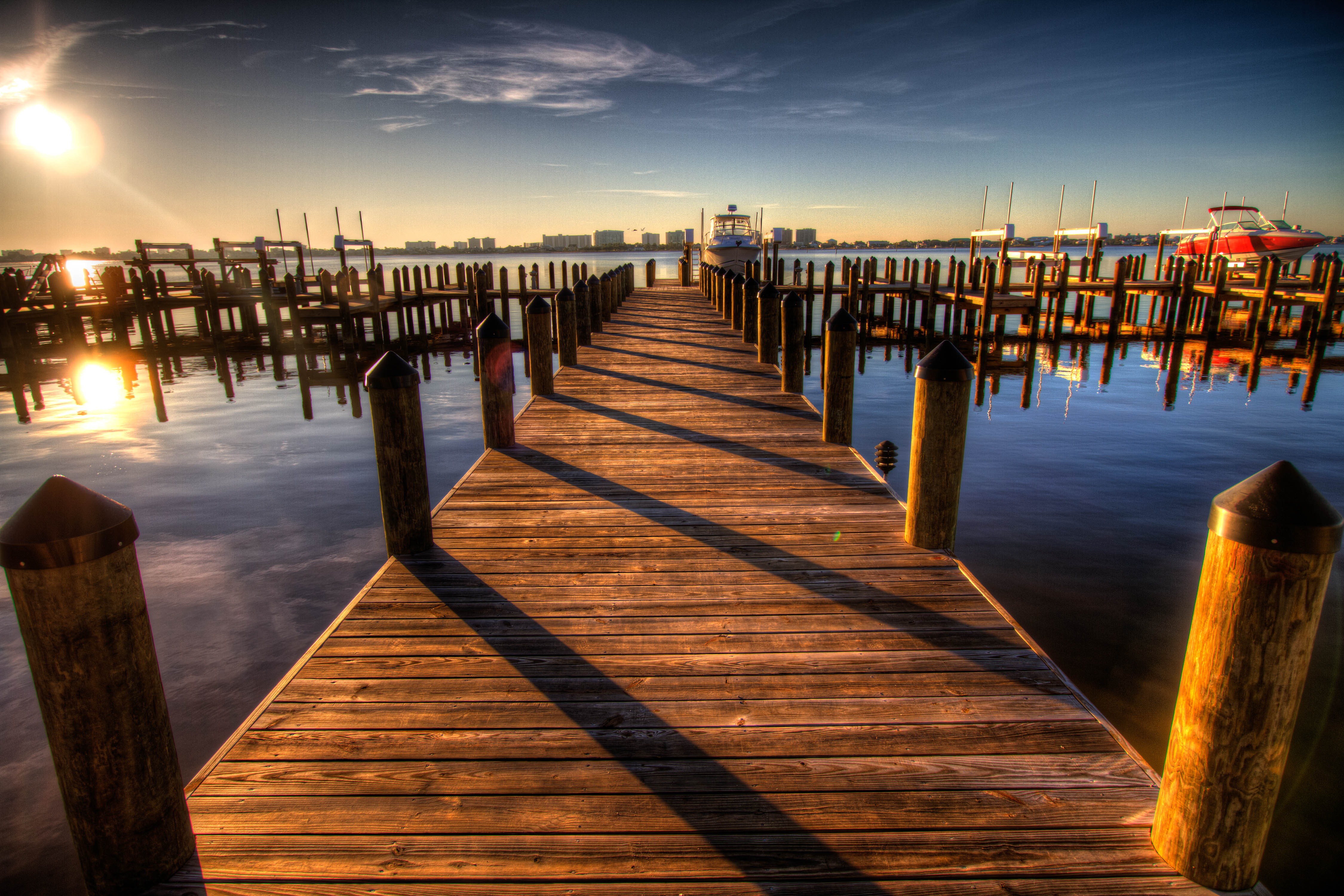Walking along the wooden pier at sunset