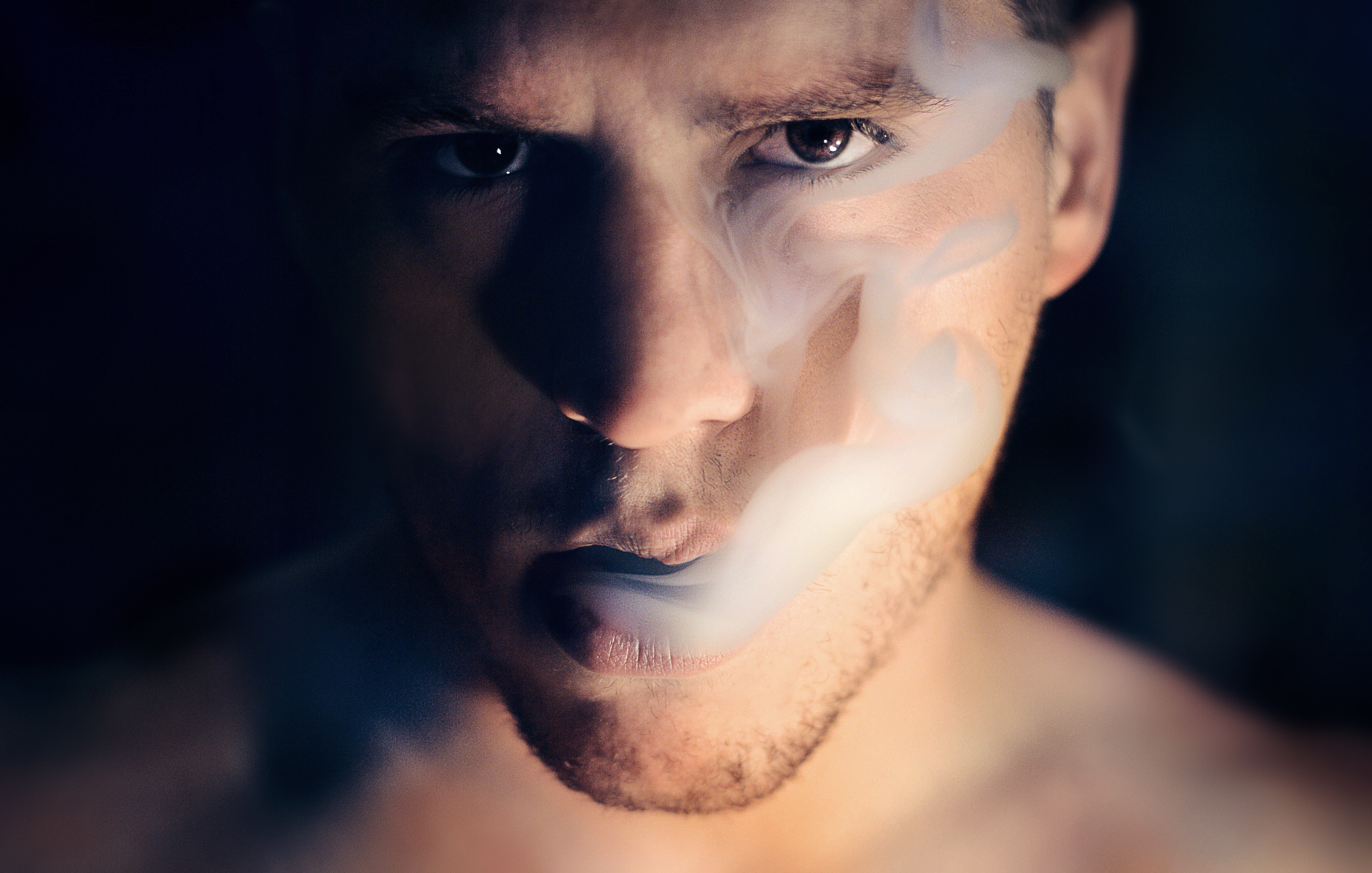 Free photo The guy exhales smoke