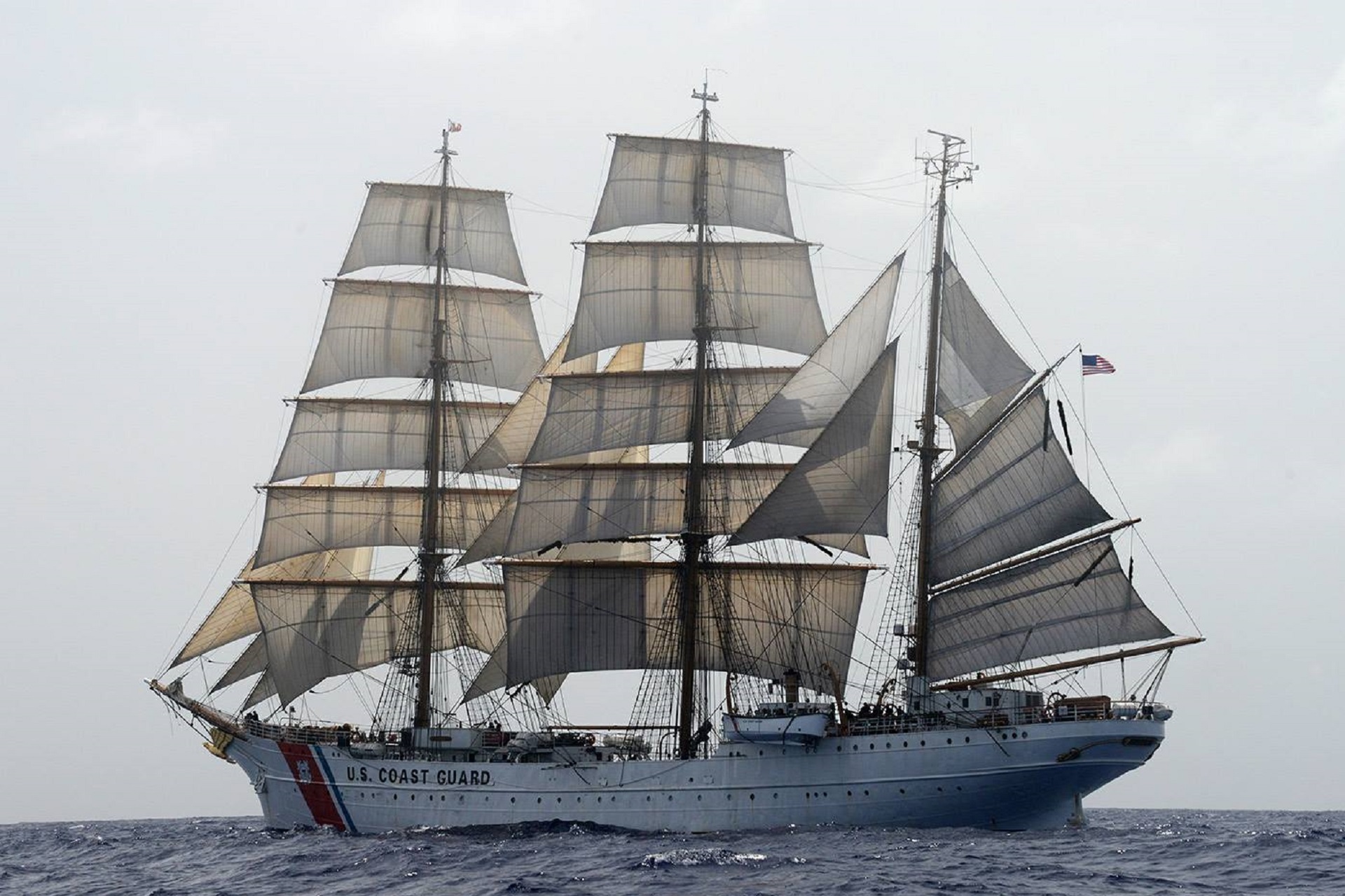 Free photo A ship with white sails