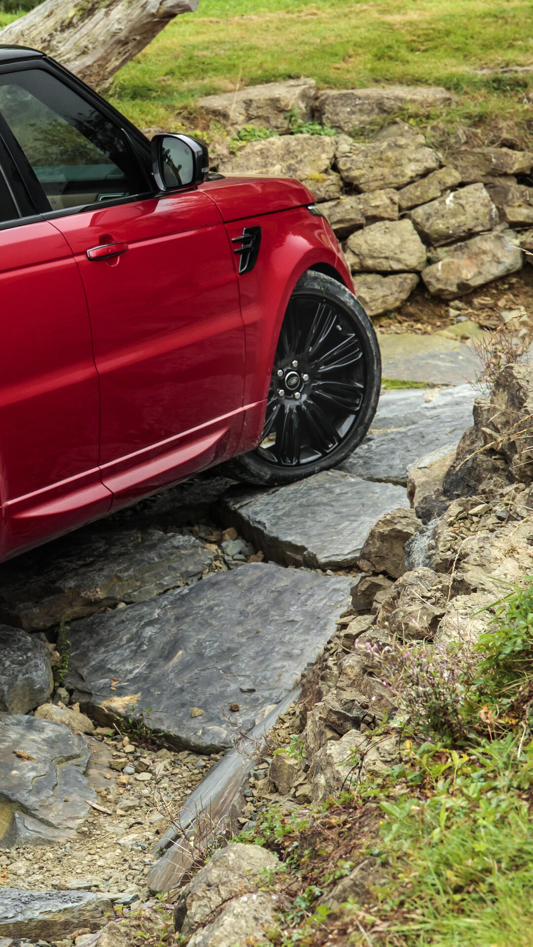 A red Range Rover driving over rocks. Β· 1080x1920 iPhone 6S+/7+/8+ free ...