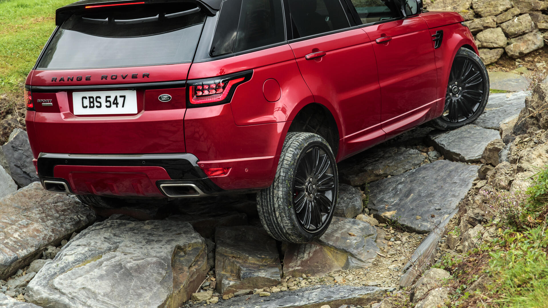 A red Range Rover driving over rocks. · 1920x1080 Full HD free photo ...