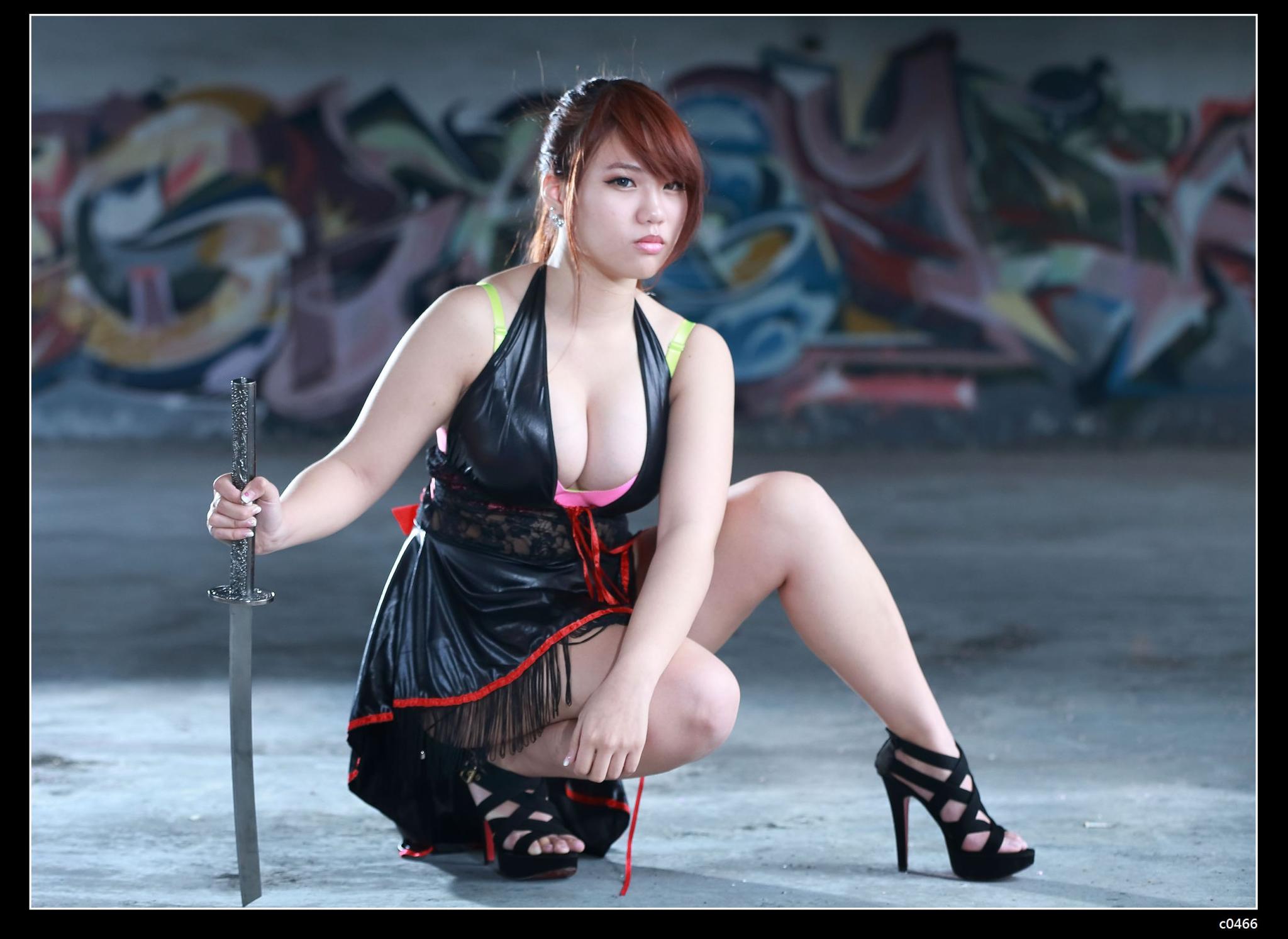 The girl with the katana in the leather dress