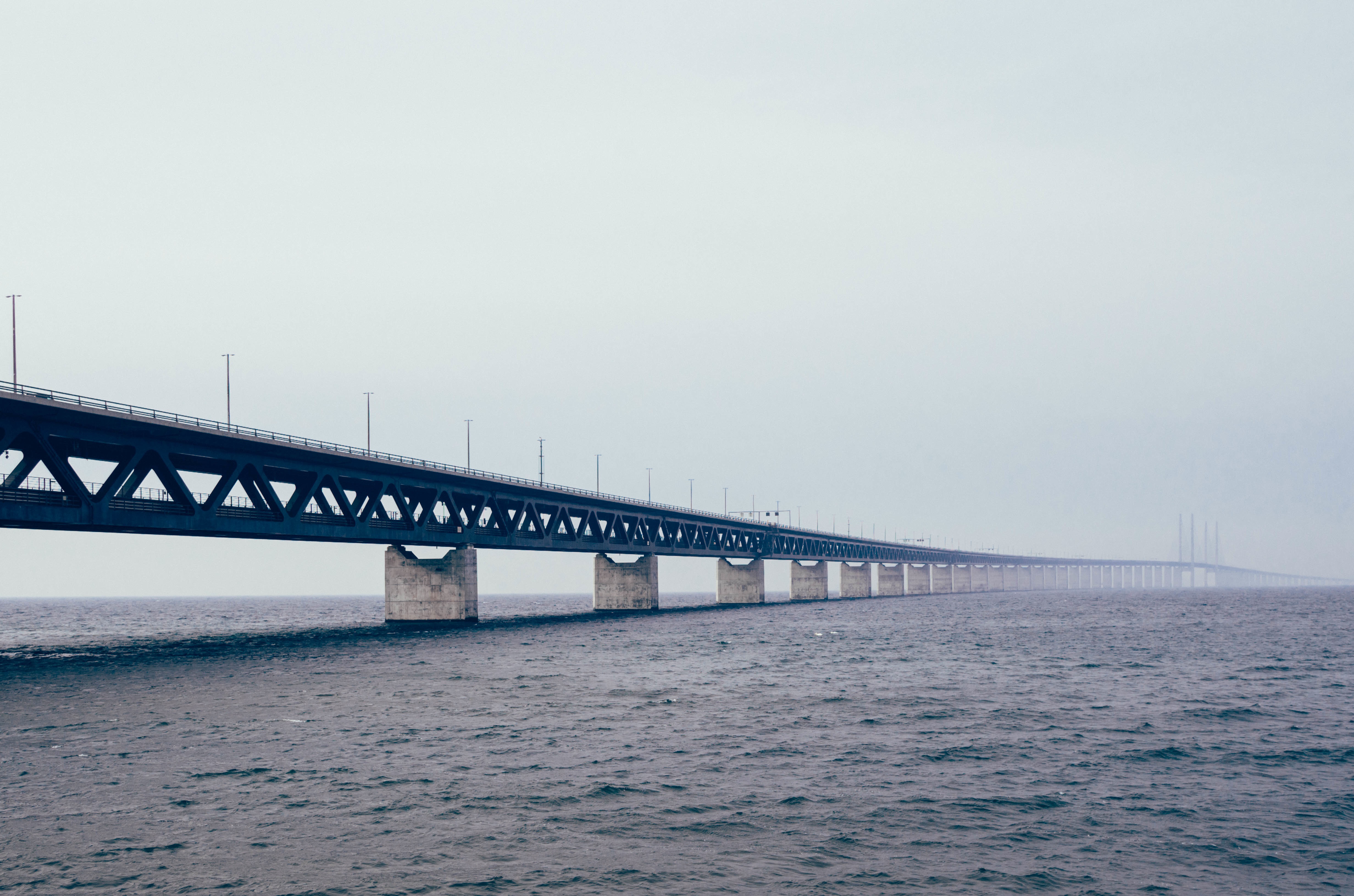 A long bridge over the sea in cloudy weather