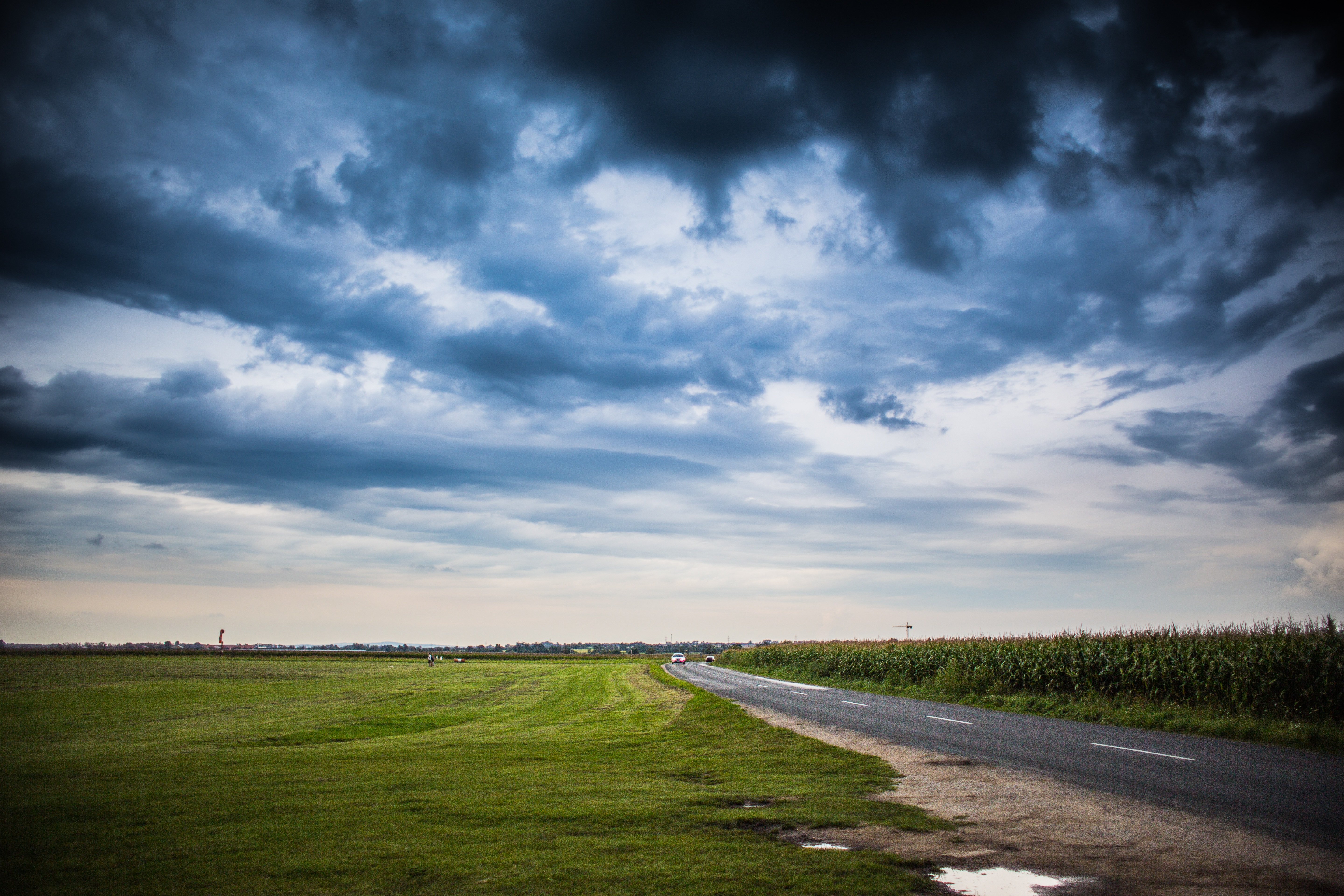 Free photo Clouds over a field of corn