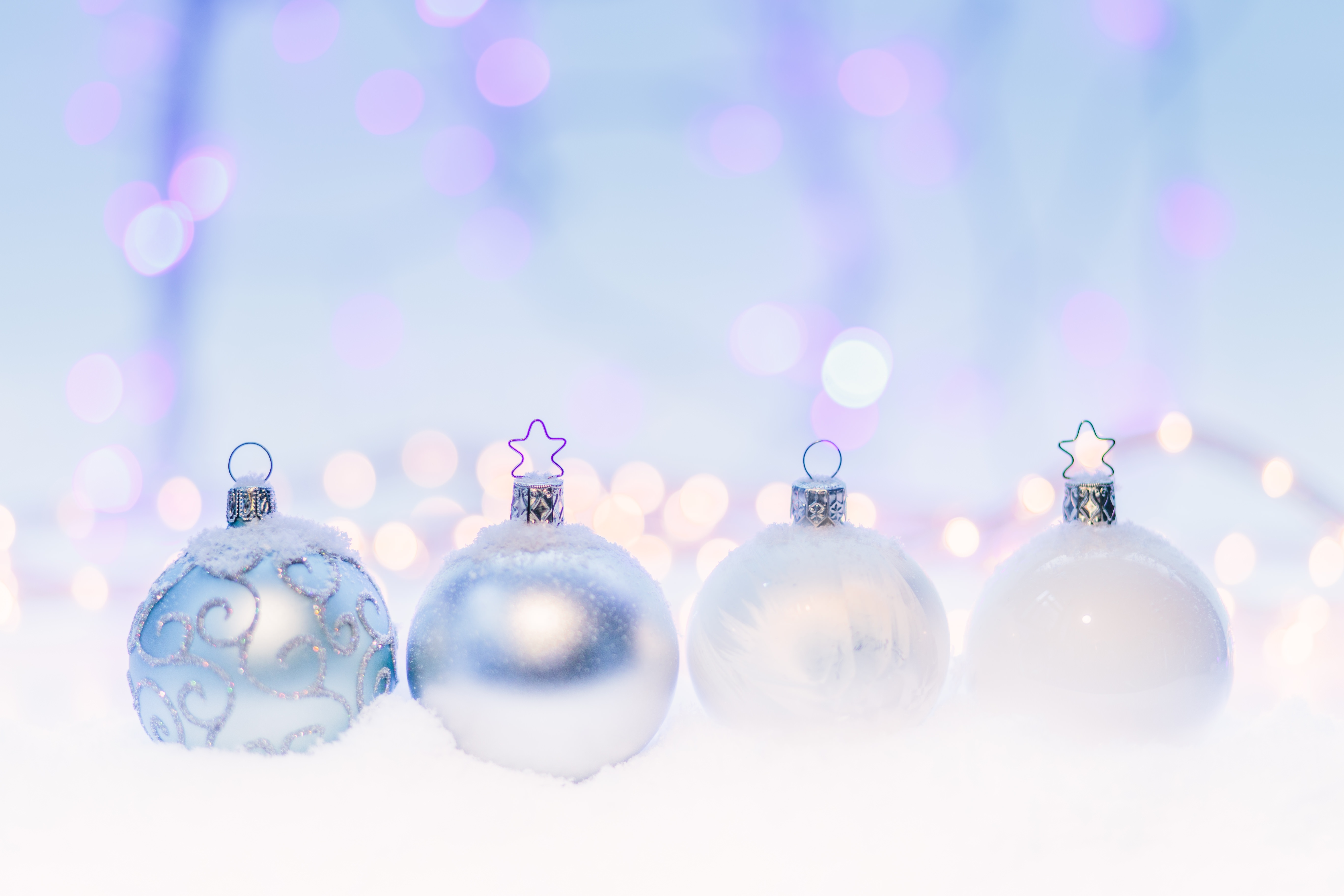 Free photo New Year`s Eve balls lying in the snow